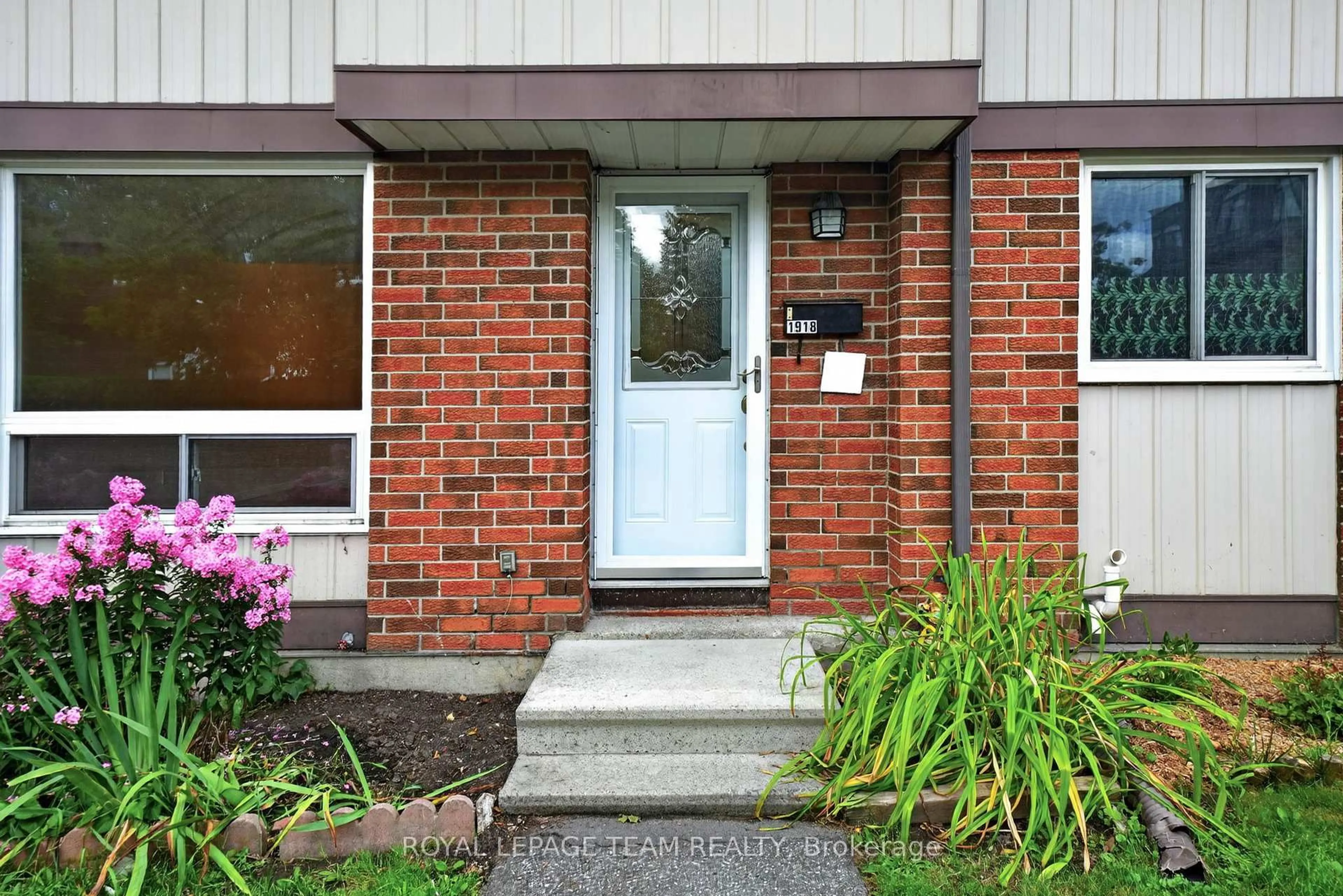 Home with brick exterior material, street for 1918 Belmore Lane #13, Ottawa Ontario K1B 4Z8