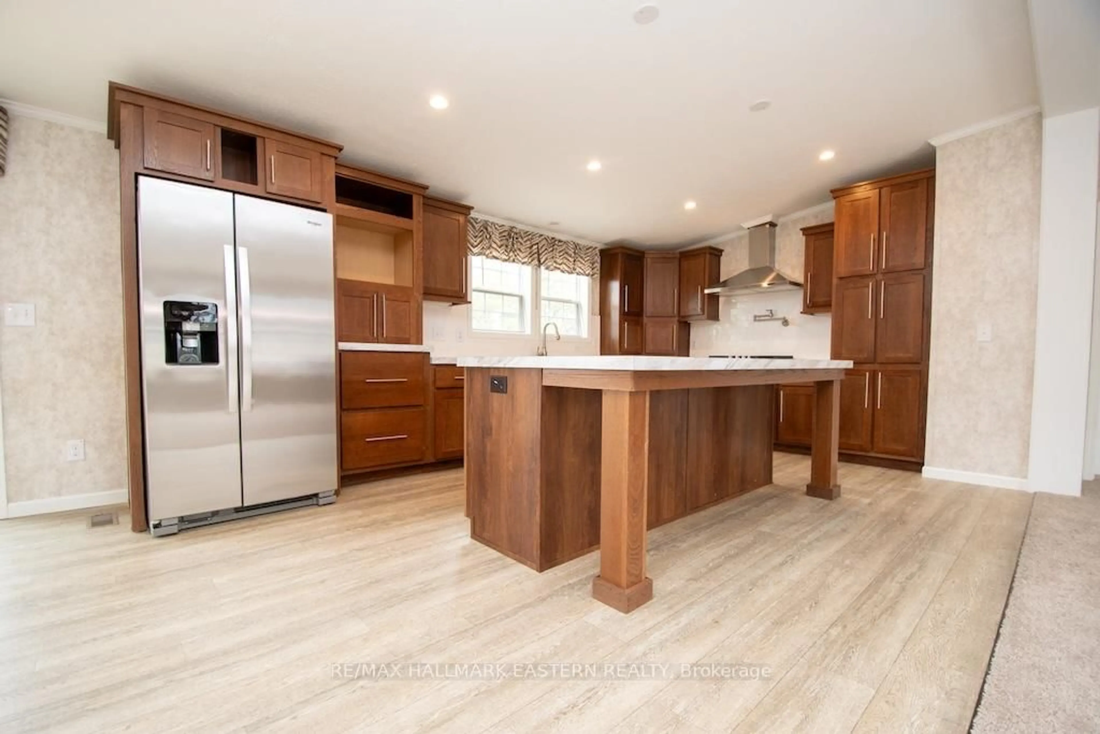 Open concept kitchen, wood/laminate floor for 1862 Lakehurst Rd, Trent Lakes Ontario K0L 1J0