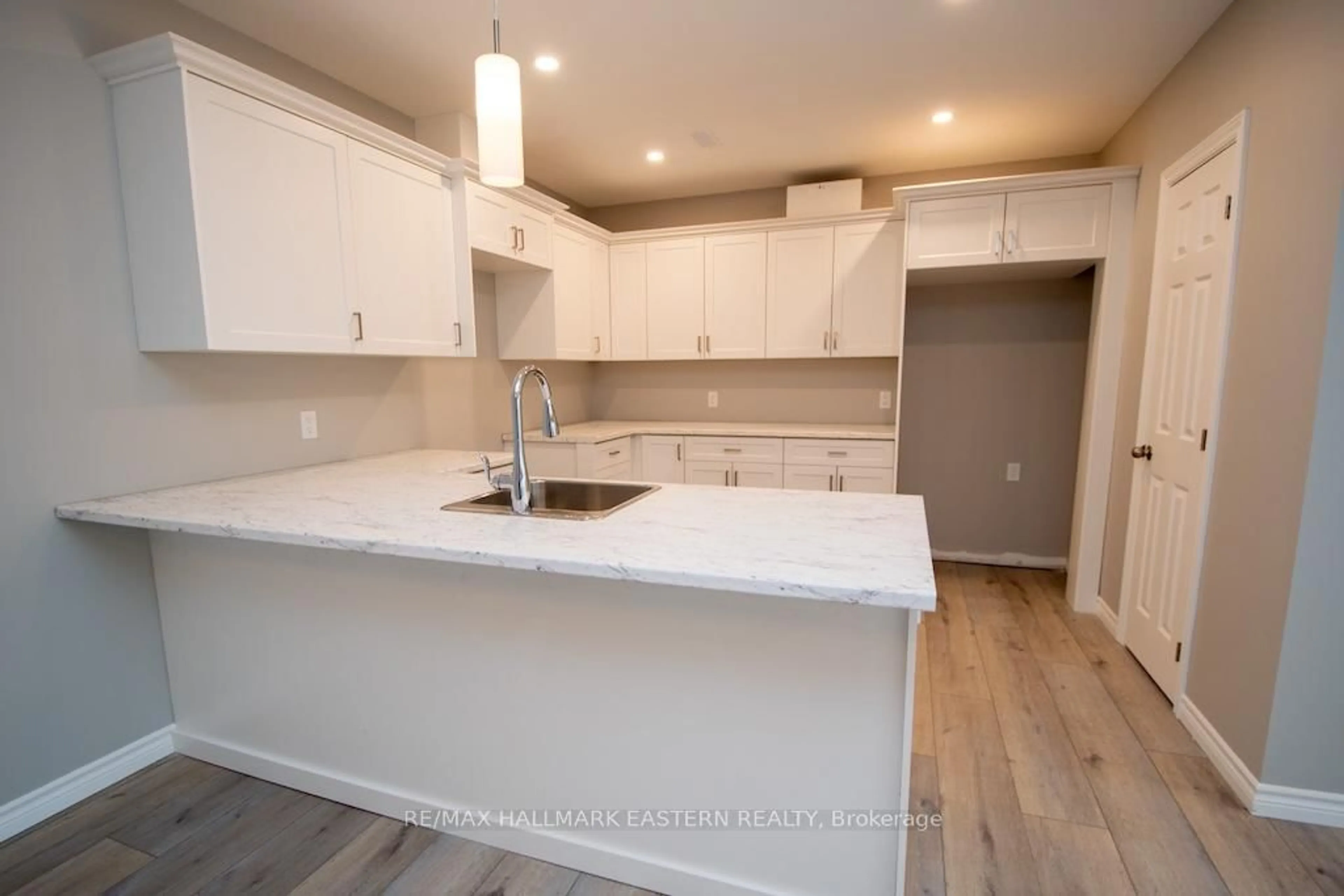 Open concept kitchen, wood/laminate floor for 1862 Lakehurst Rd, Trent Lakes Ontario K0L 1J0