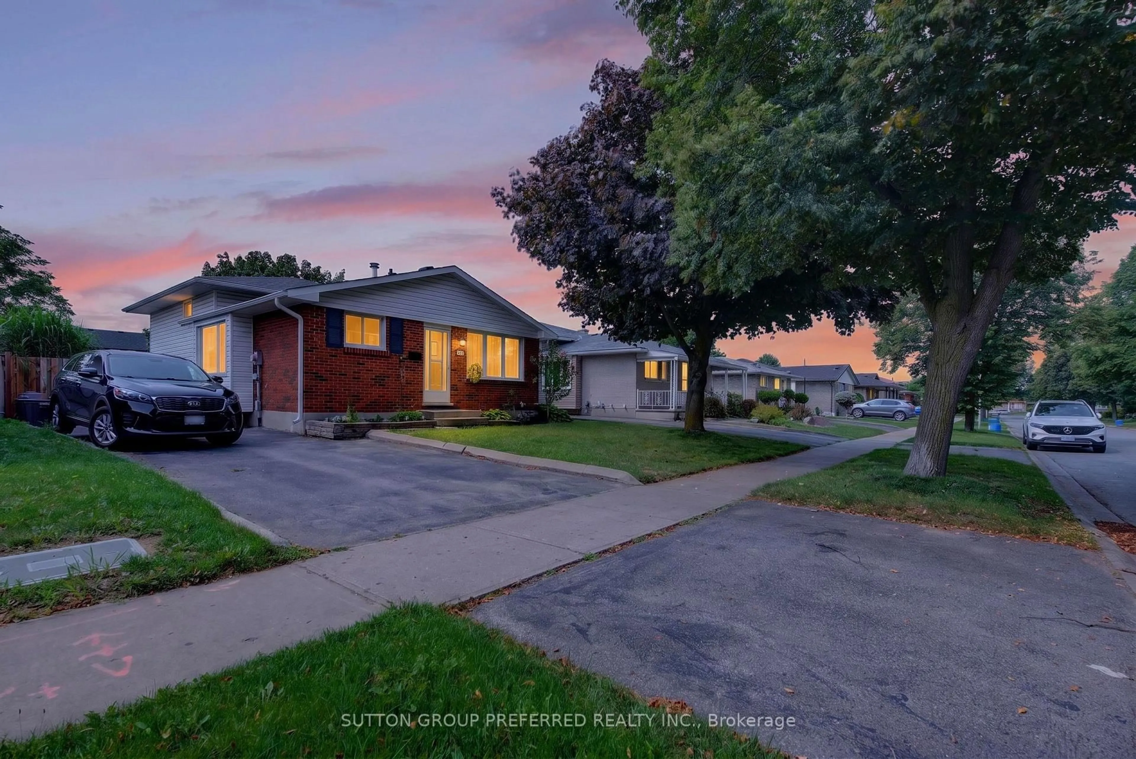 A pic from outside/outdoor area/front of a property/back of a property/a pic from drone, street for 98 Surrey Cres, London South Ontario N6E 1T8