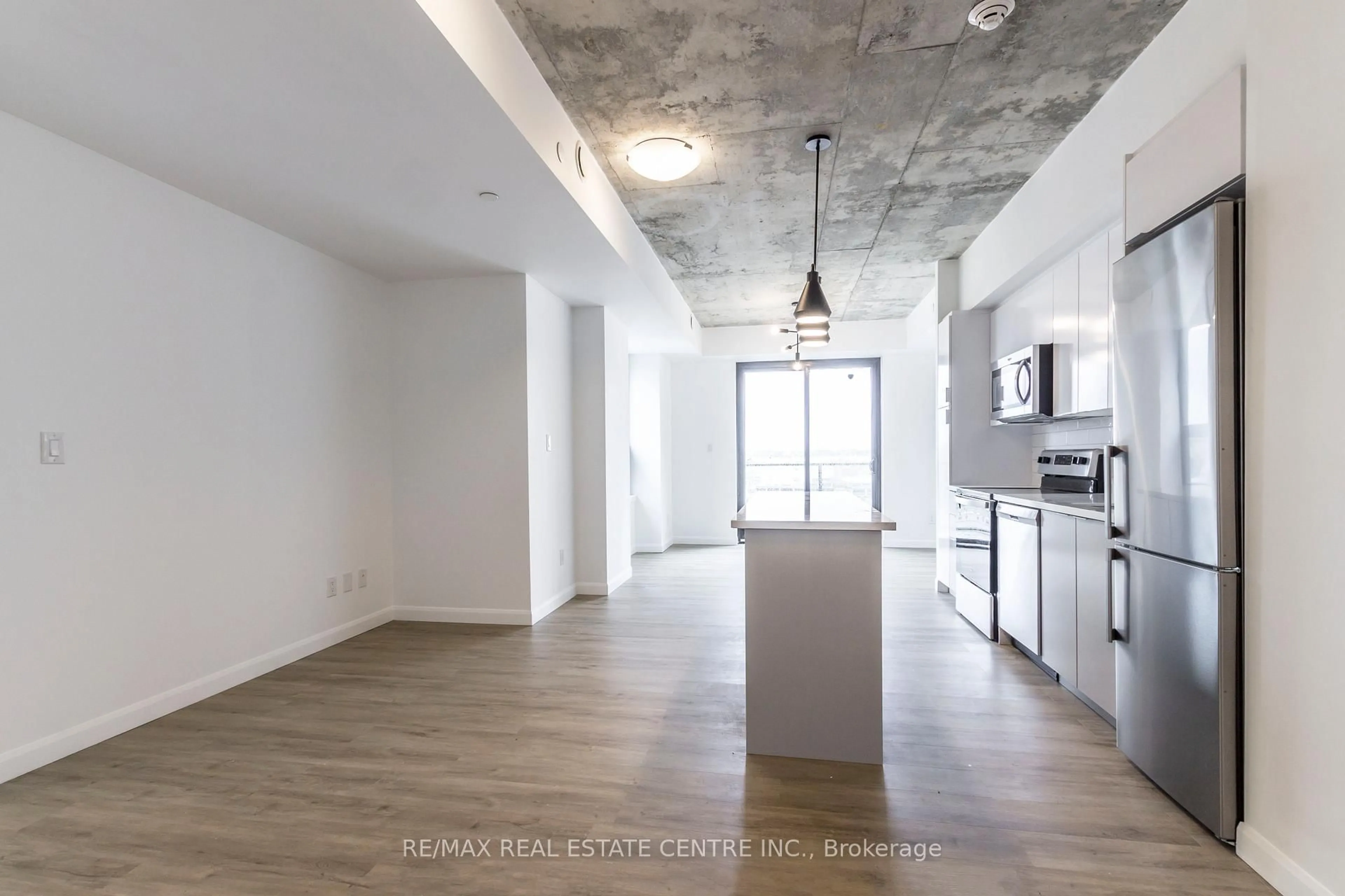 Open concept kitchen, cement floor for 7 Erie Ave #812, Brantford Ontario N3S 2E7