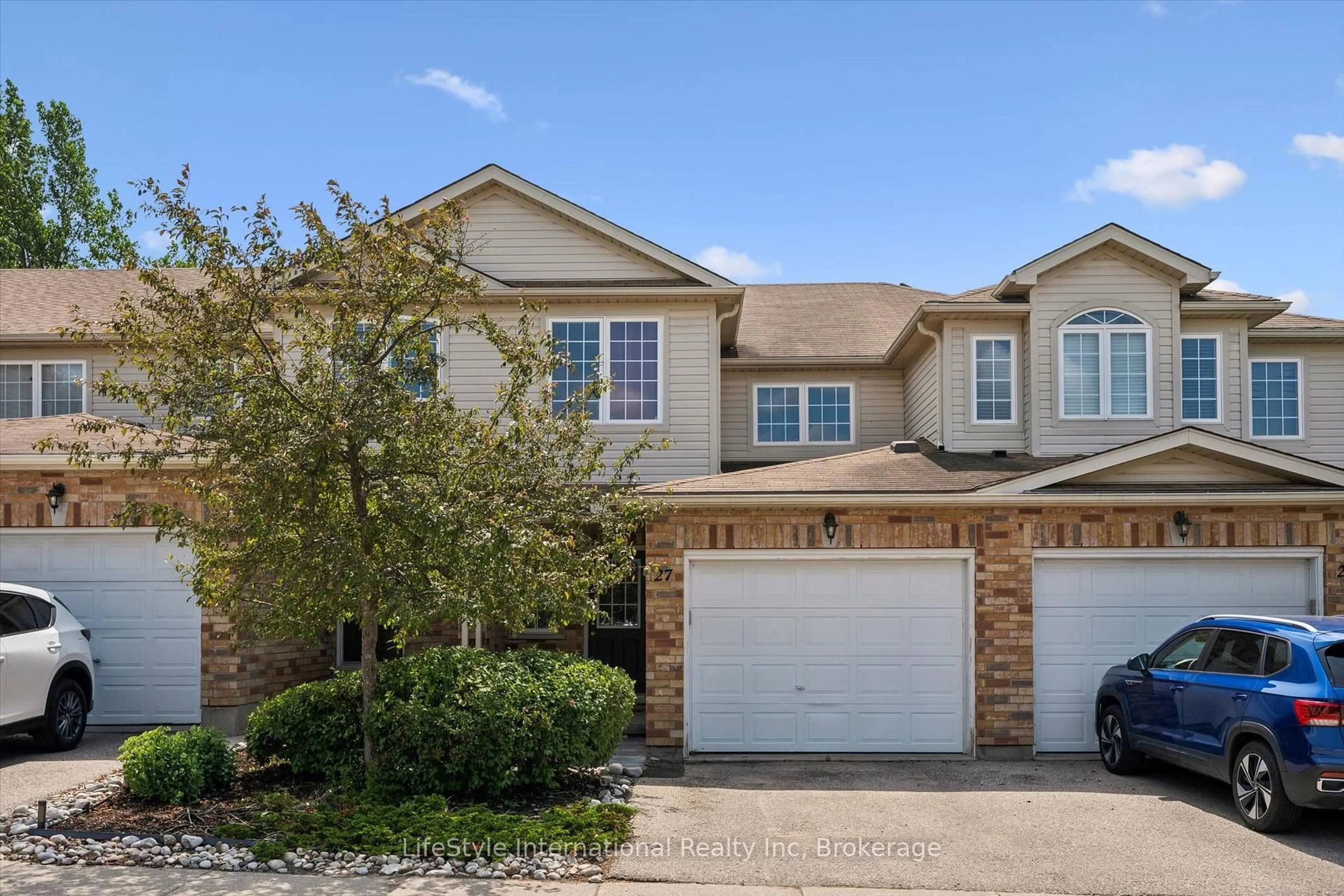 Home with brick exterior material, street for 105 Bard Blvd #27, Guelph Ontario N1L 0E2