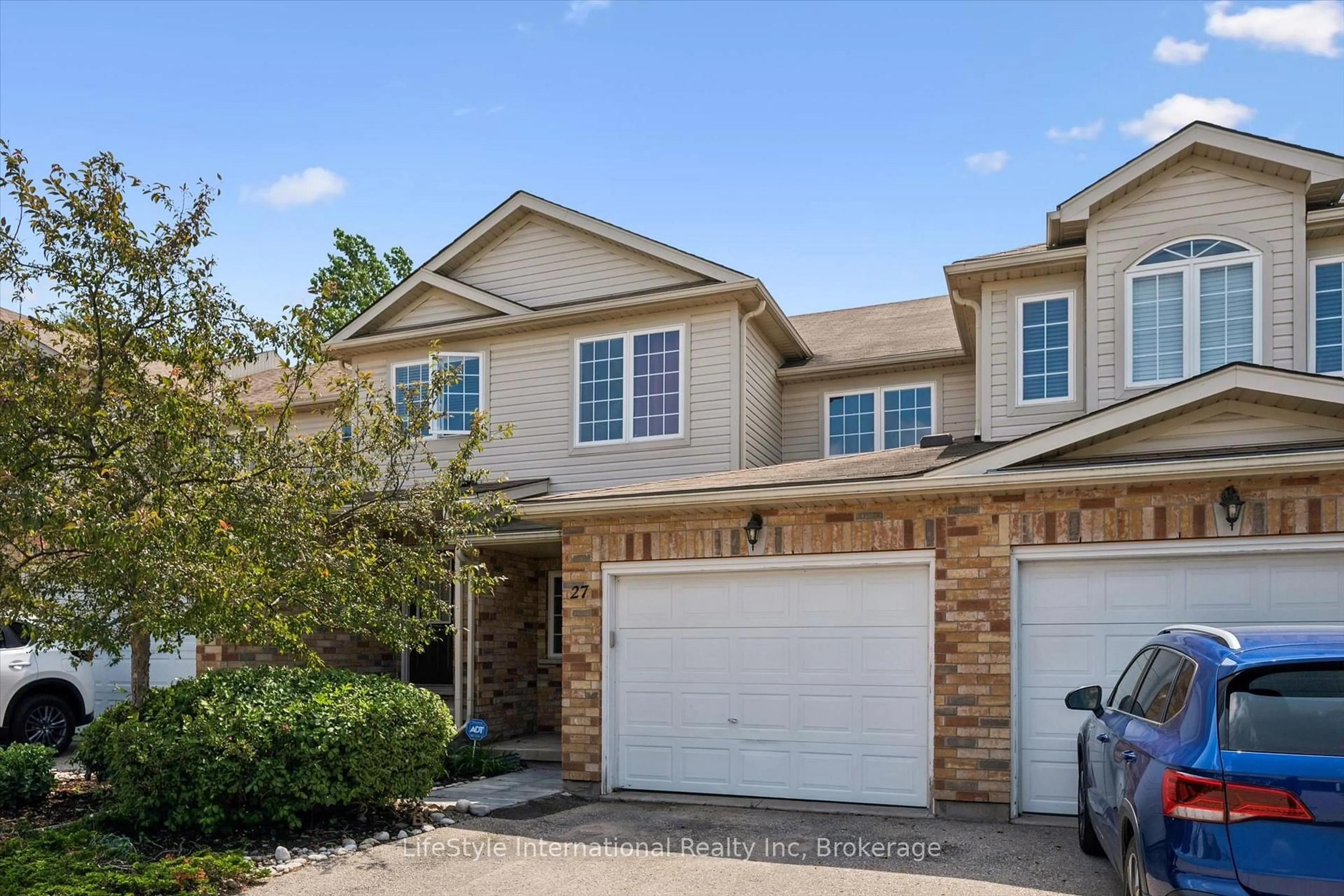 Home with brick exterior material, street for 105 Bard Blvd #27, Guelph Ontario N1L 0E2
