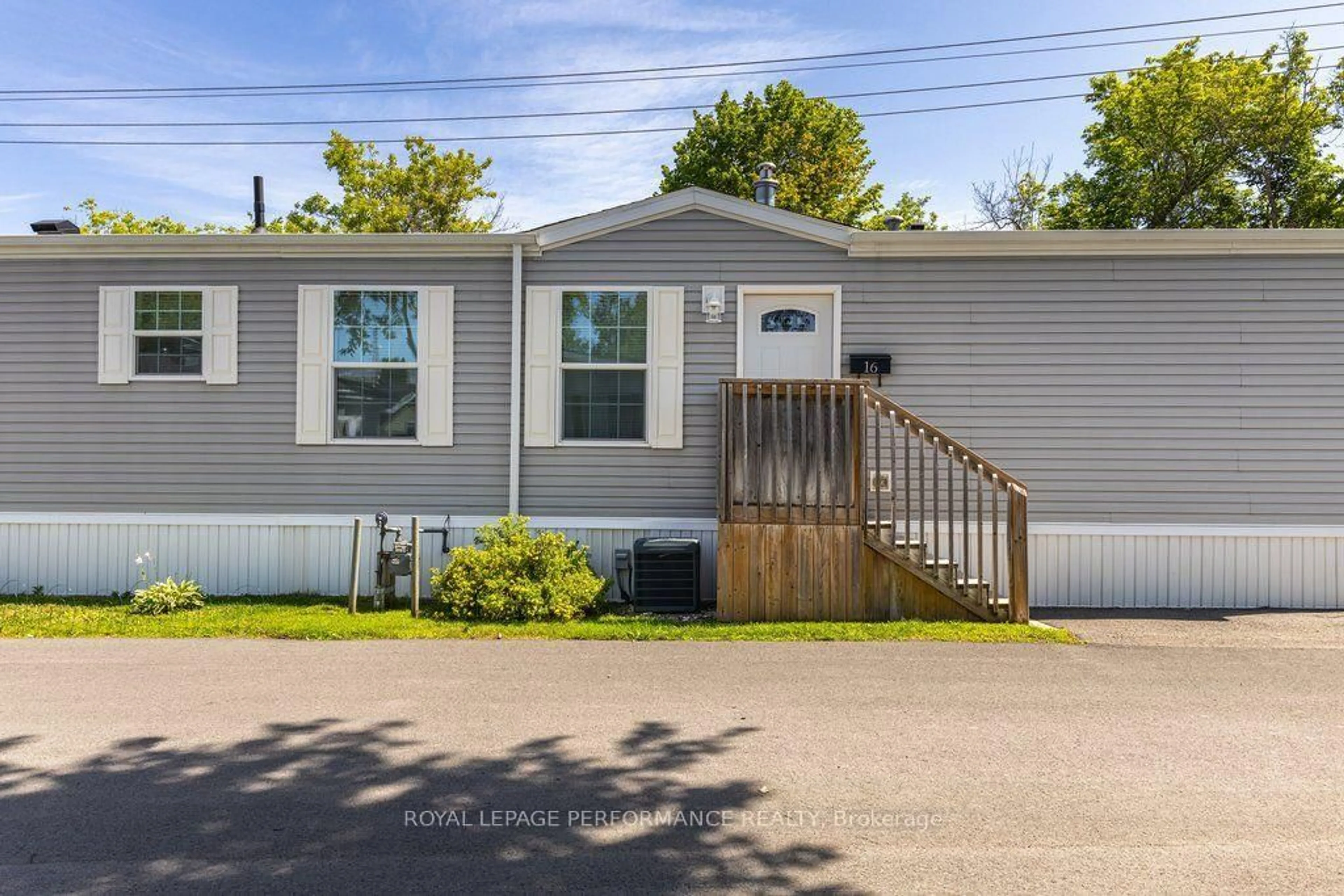 Home with vinyl exterior material, street for 16 Eastgate Ave, Ottawa Ontario K2H 7S2