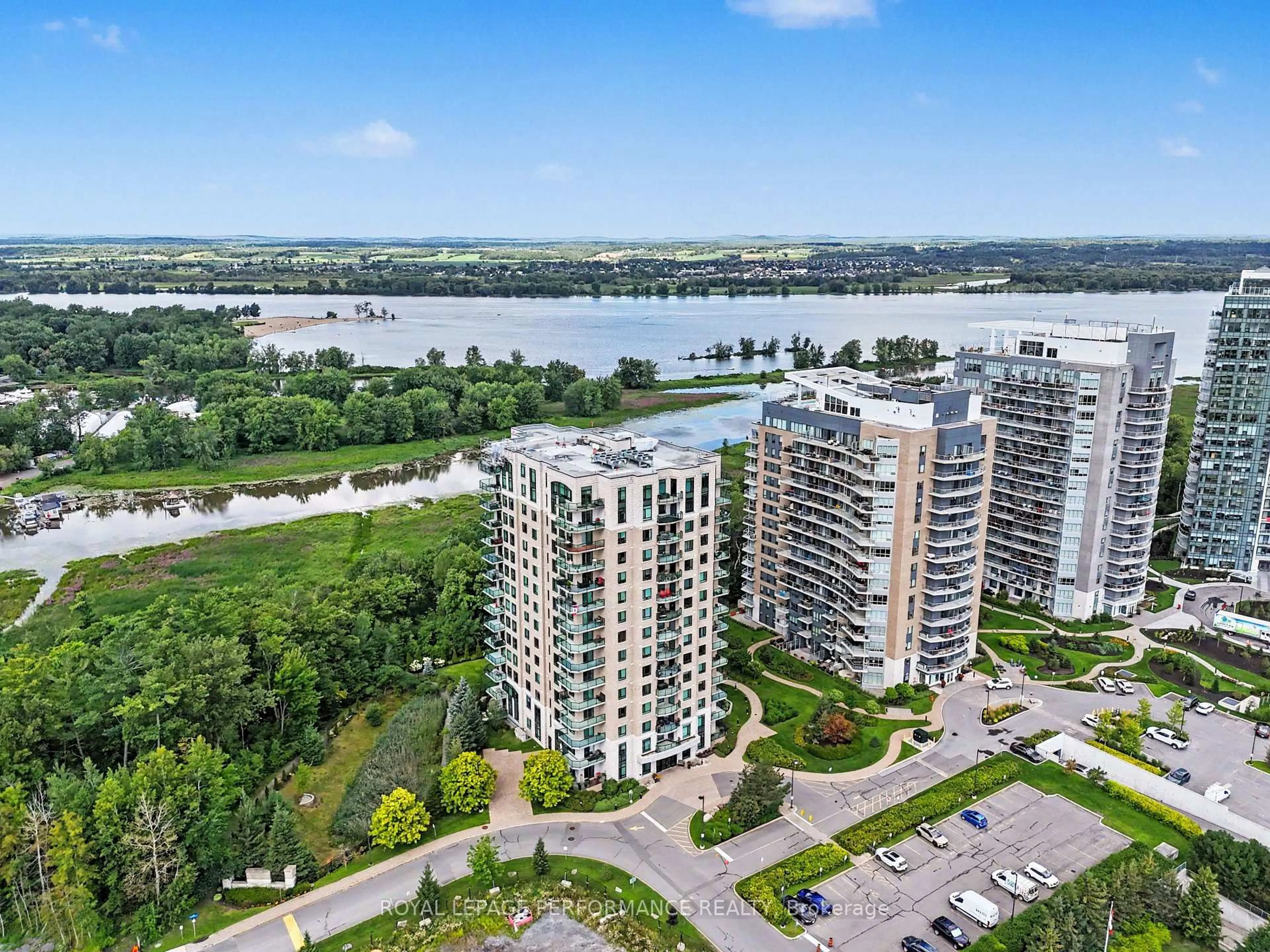 A pic from outside/outdoor area/front of a property/back of a property/a pic from drone, water/lake/river/ocean view for 100 Inlet Private #704, Ottawa Ontario K4A 0S8
