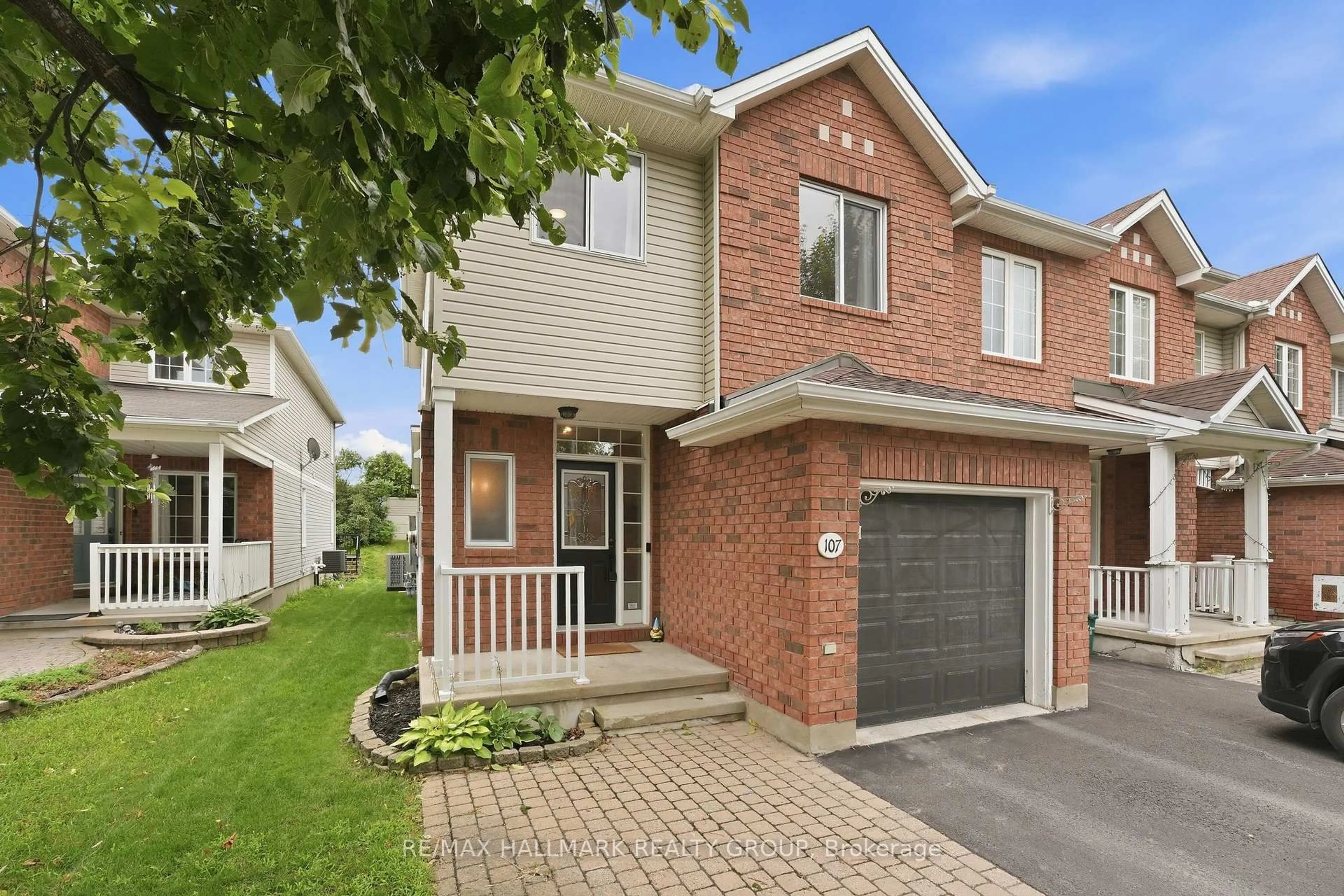 Home with brick exterior material, street for 107 Bishops Mills Way, Ottawa Ontario K2K 3C2