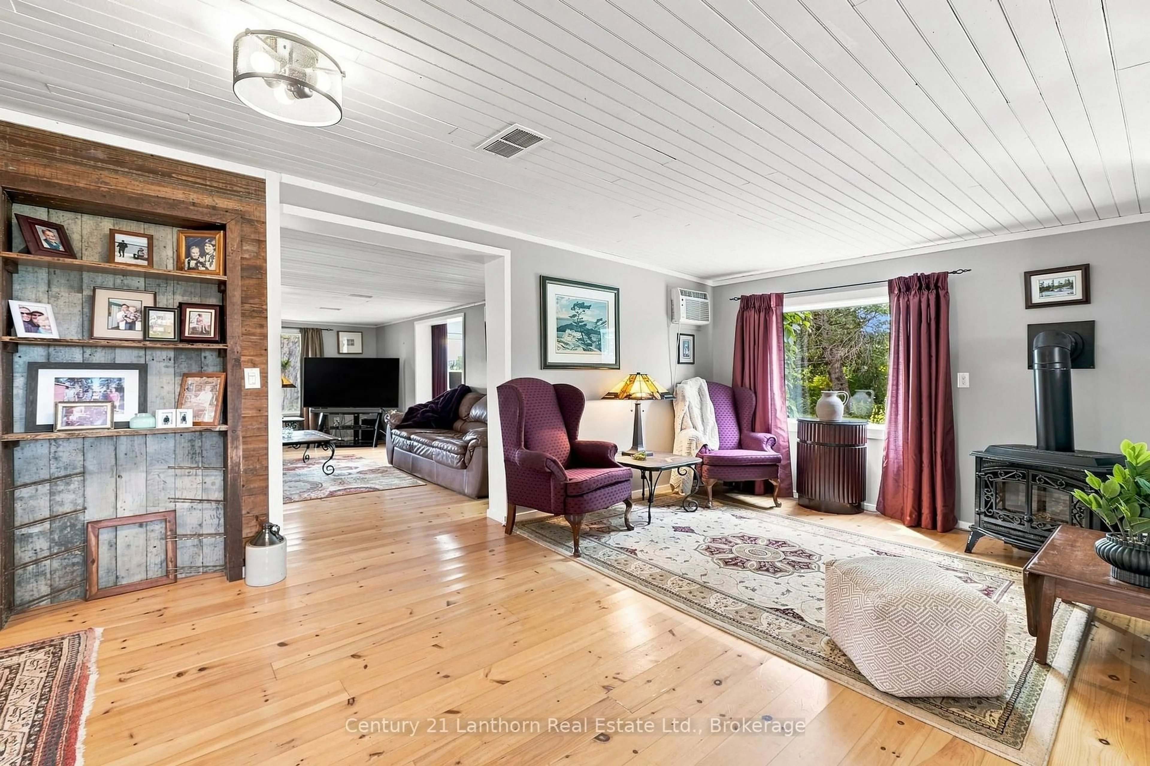 Living room with furniture, wood/laminate floor for 1083 County Road 5, Prince Edward County Ontario K0K 2T0