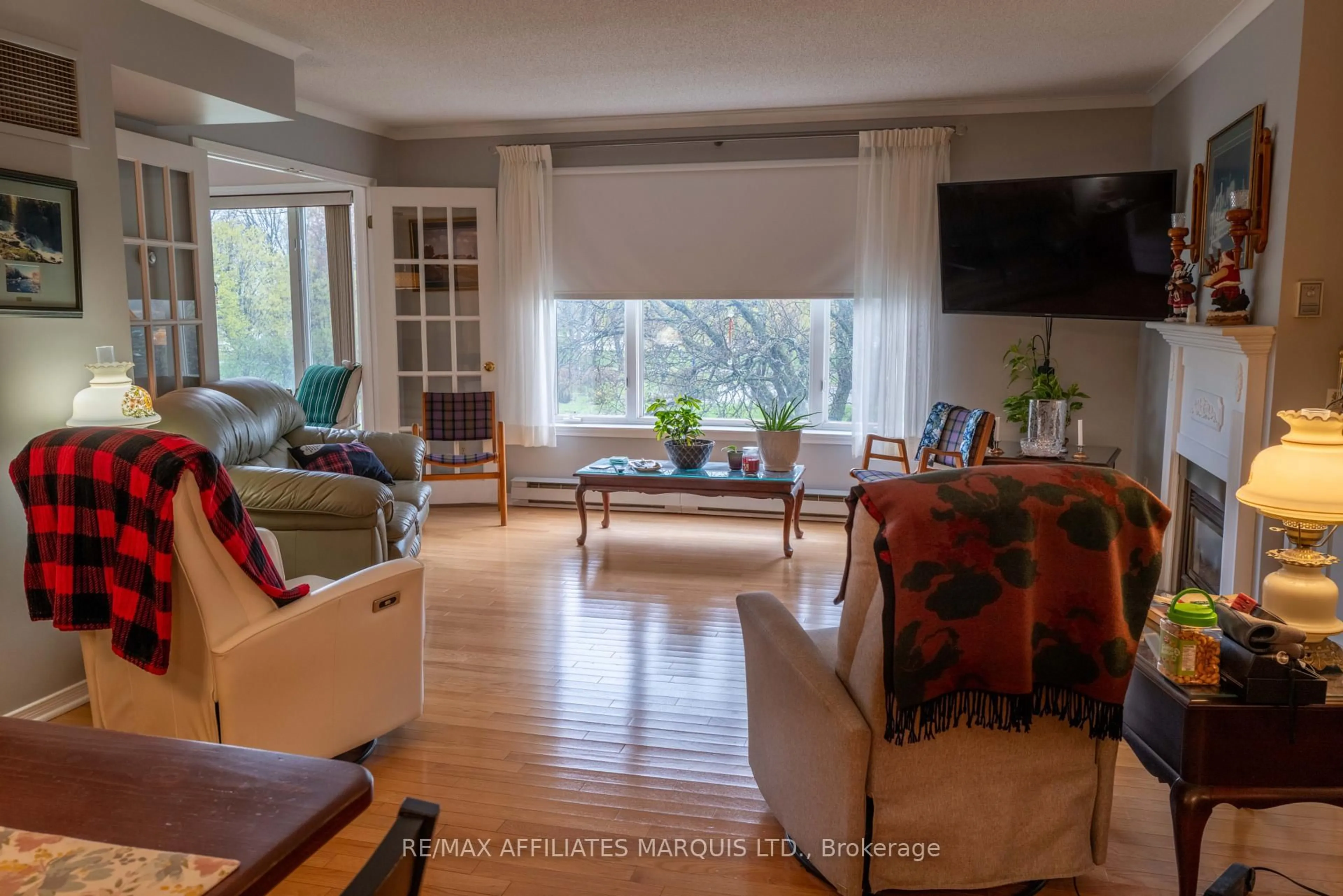 Living room with furniture, wood/laminate floor for 121 Water St #312, Cornwall Ontario K6J 5T8
