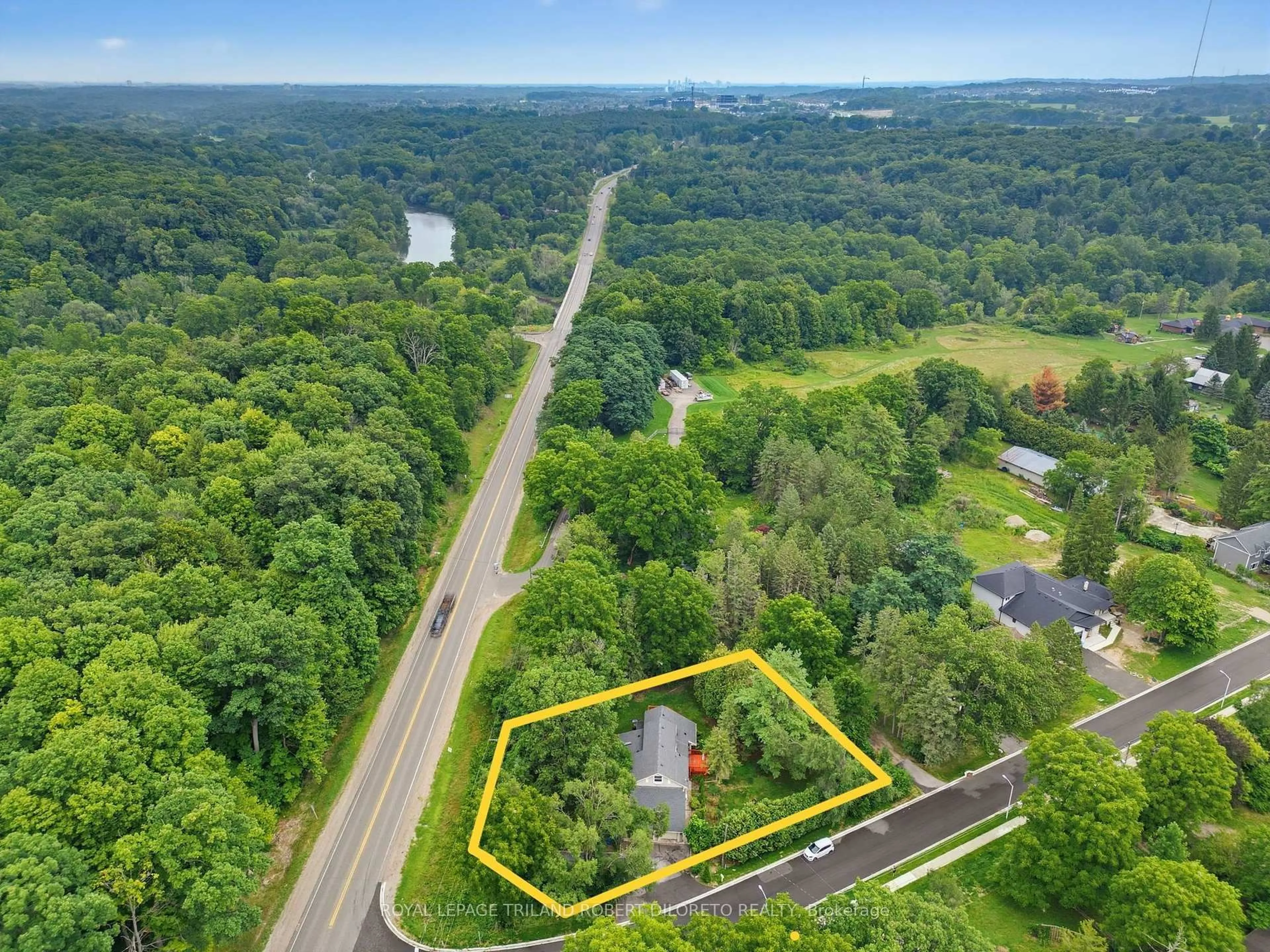 A pic from outside/outdoor area/front of a property/back of a property/a pic from drone, forest/trees view for 7 Elmhurst St, Middlesex Centre Ontario N0L 1R0