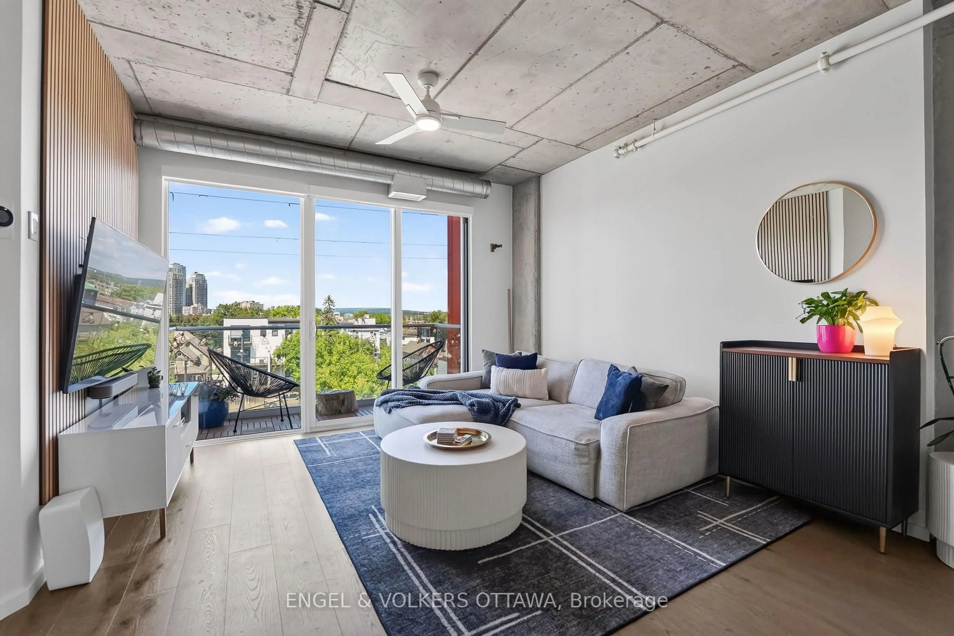 Living room with furniture, cement floor for 1000 Wellington St #403, Ottawa Ontario K1Y 2X9