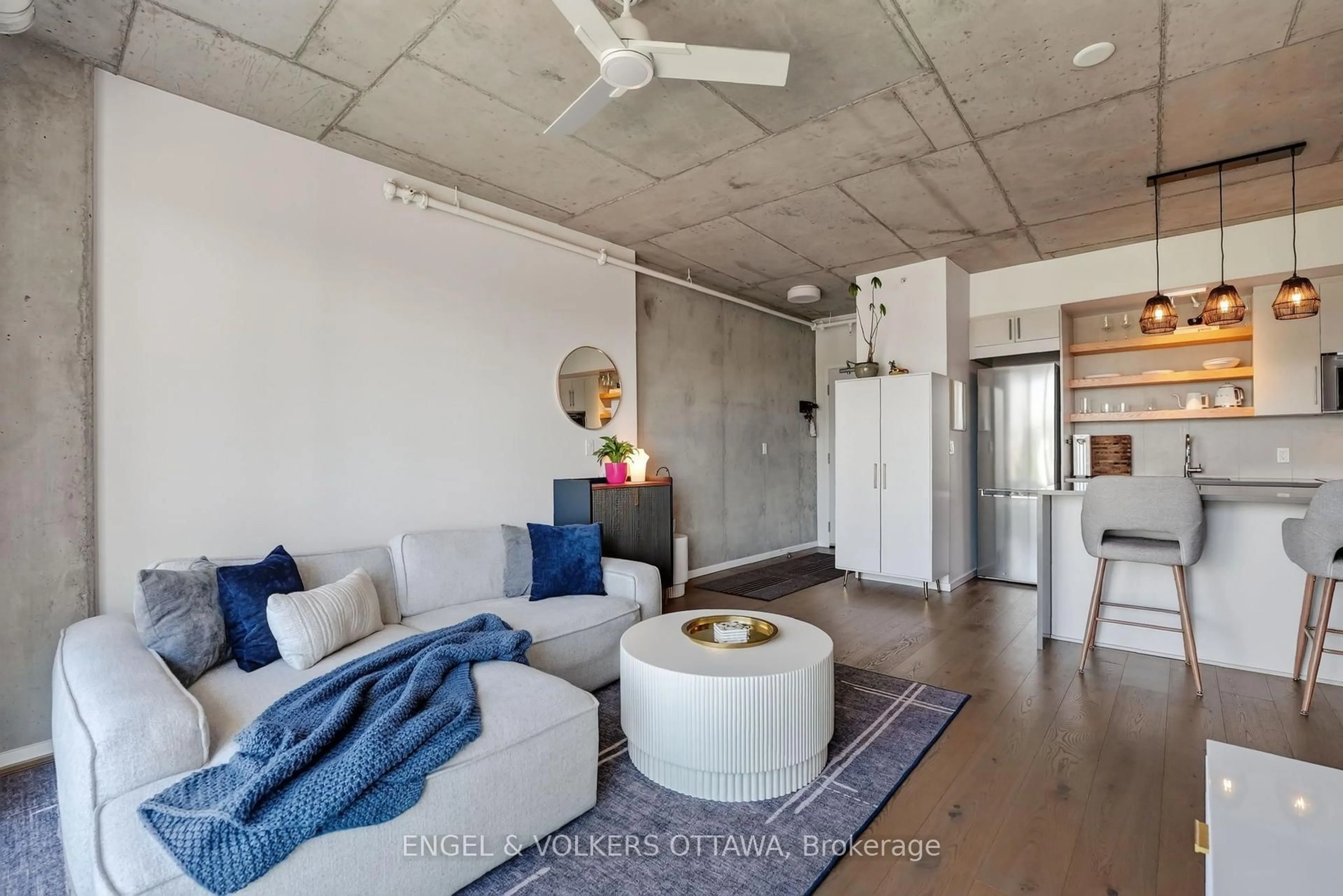 Living room with furniture, cement floor for 1000 Wellington St #403, Ottawa Ontario K1Y 2X9