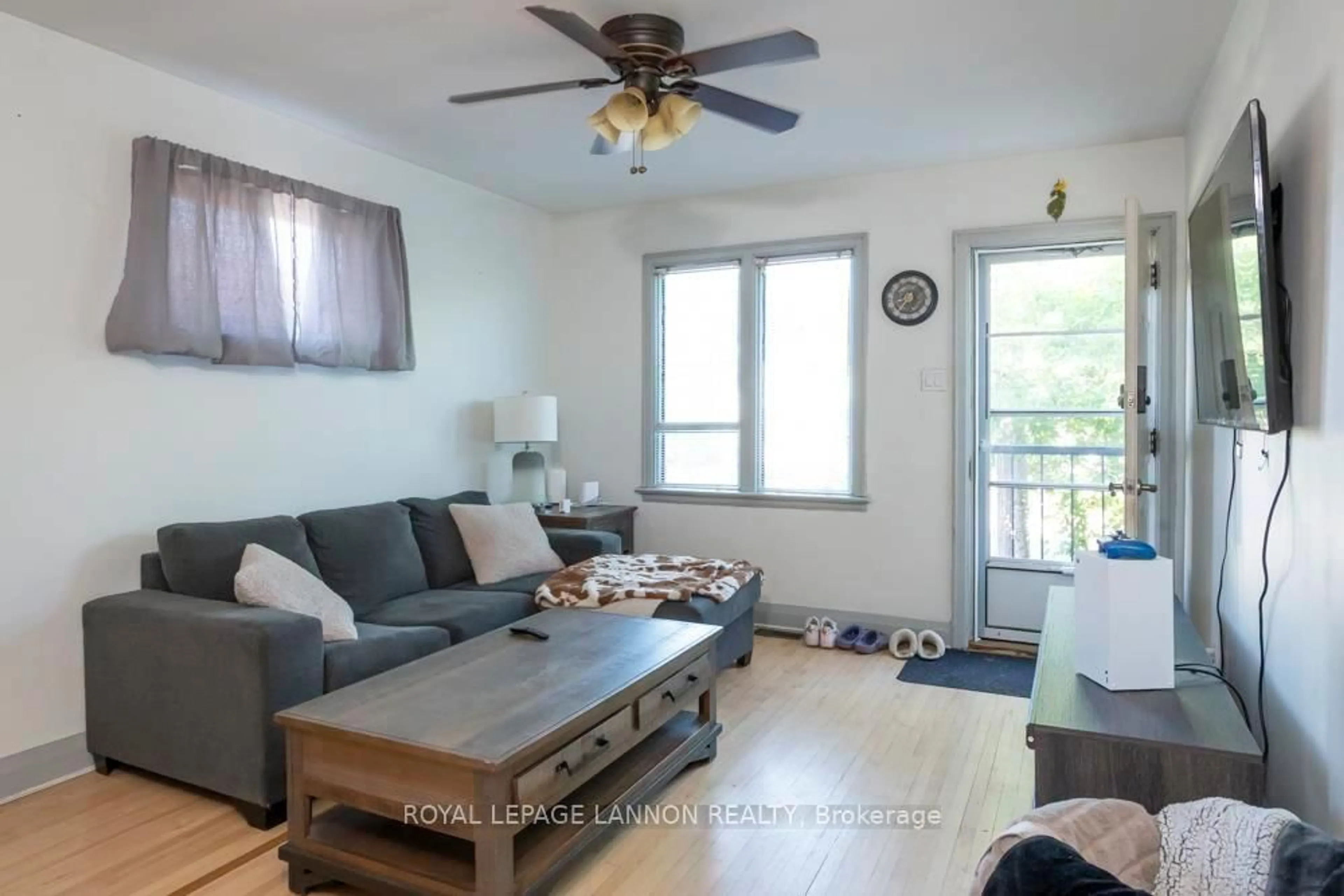 Living room with furniture, wood/laminate floor for 185 Empress St S, Thunder Bay Ontario P7B 4N8