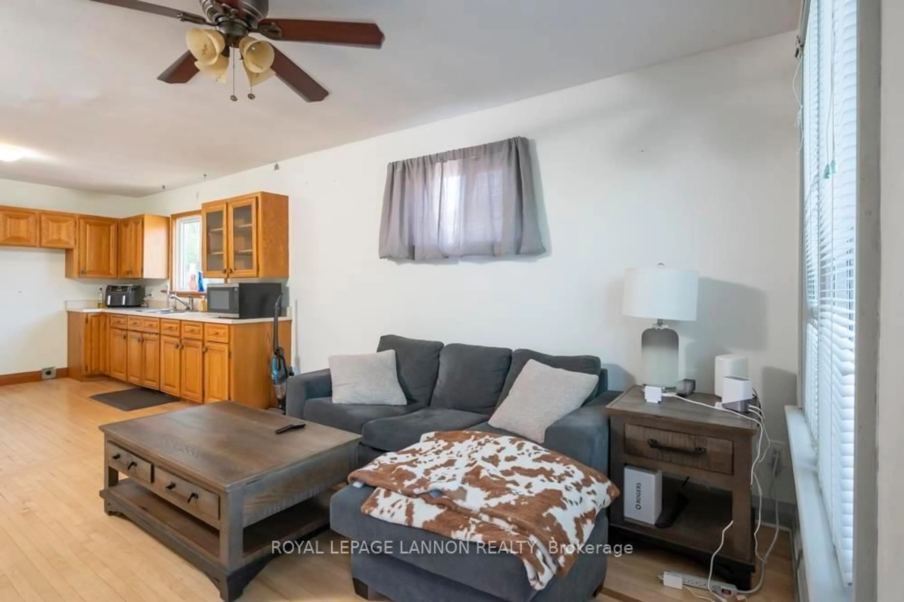 Living room with furniture, wood/laminate floor for 185 Empress St S, Thunder Bay Ontario P7B 4N8
