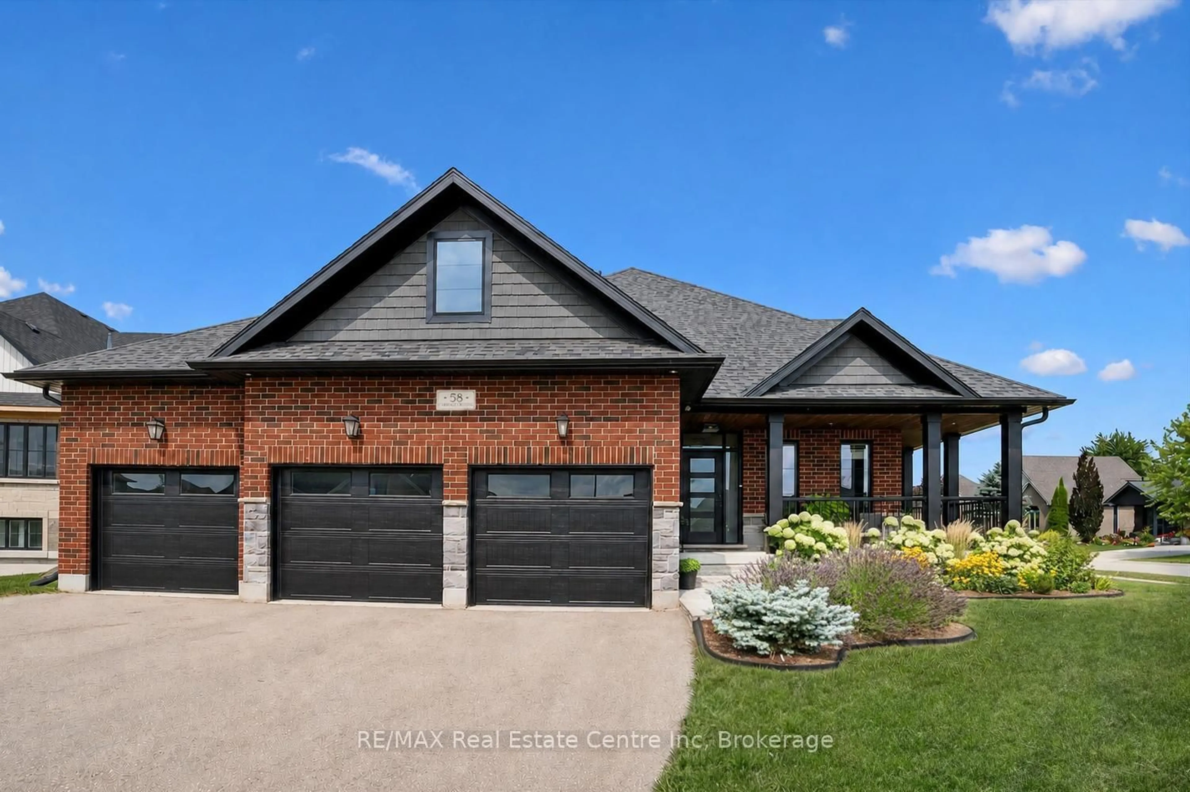 Home with brick exterior material, street for 58 Carriage Crossing, Mapleton Ontario N0G 1P0