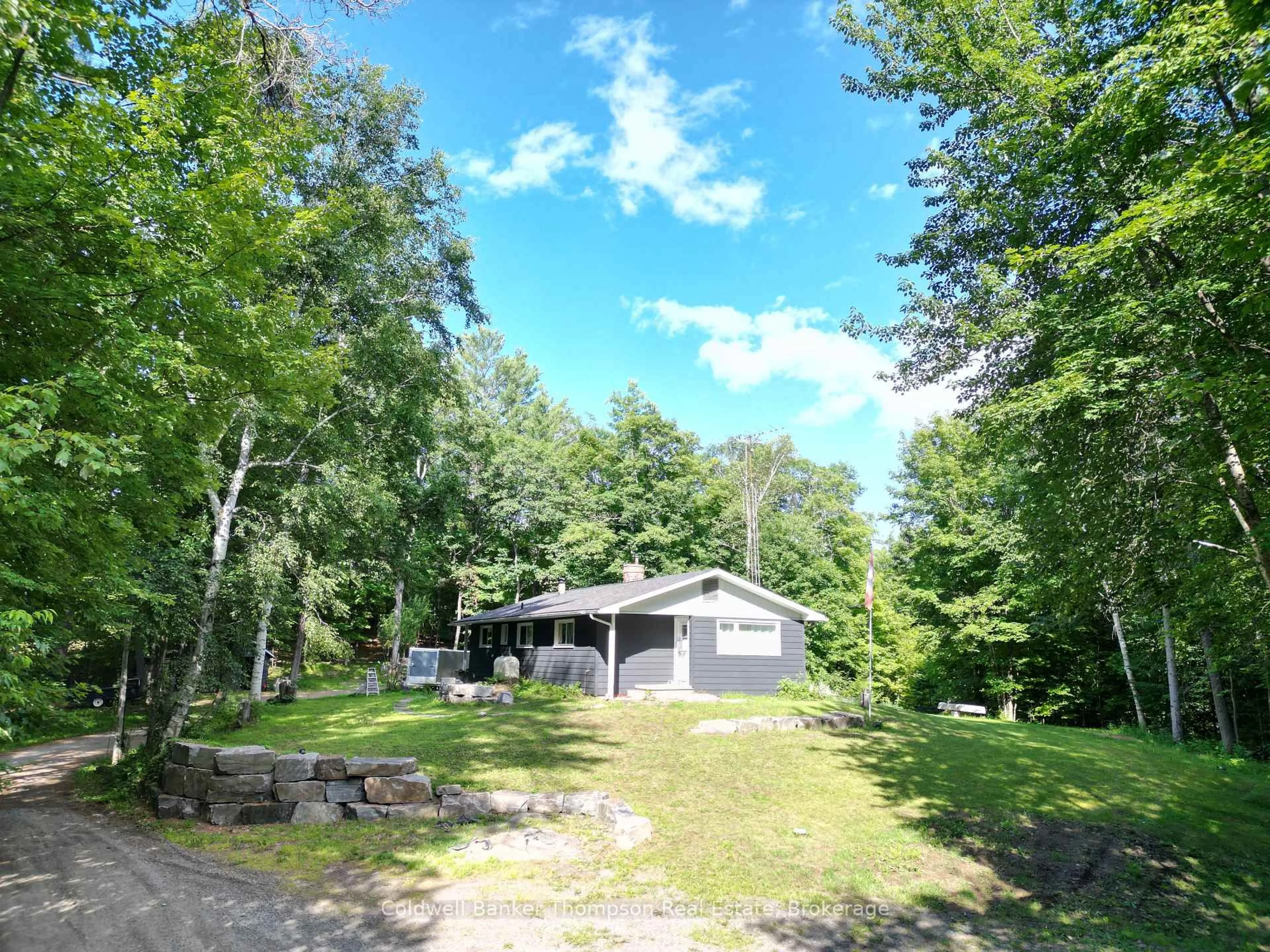 A pic from outside/outdoor area/front of a property/back of a property/a pic from drone, water/lake/river/ocean view for 21 Ripple & Palette Lake Rd, Huntsville Ontario P1H 2J4