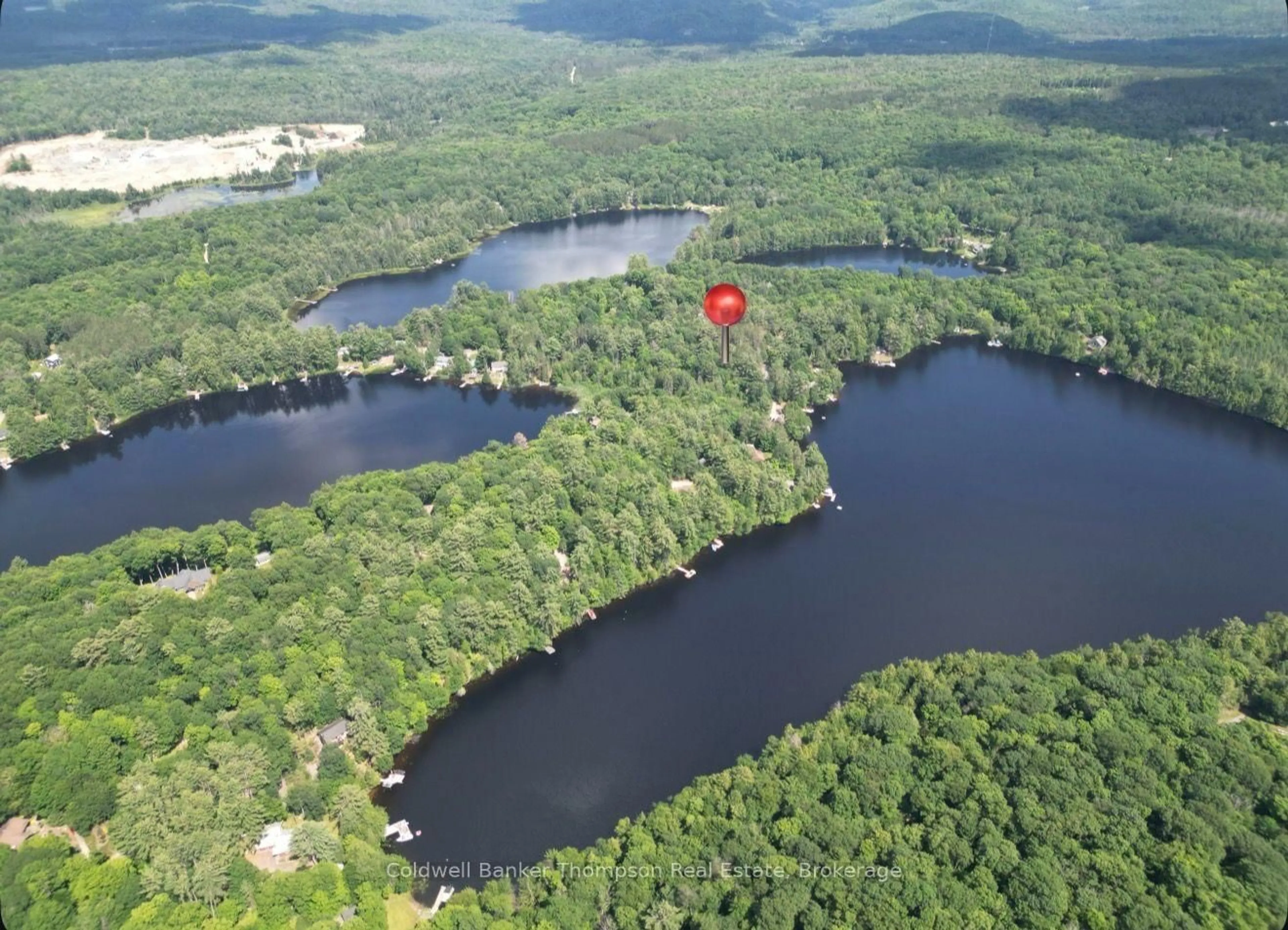 A pic from outside/outdoor area/front of a property/back of a property/a pic from drone, water/lake/river/ocean view for 21 Ripple & Palette Lake Rd, Huntsville Ontario P1H 2J4