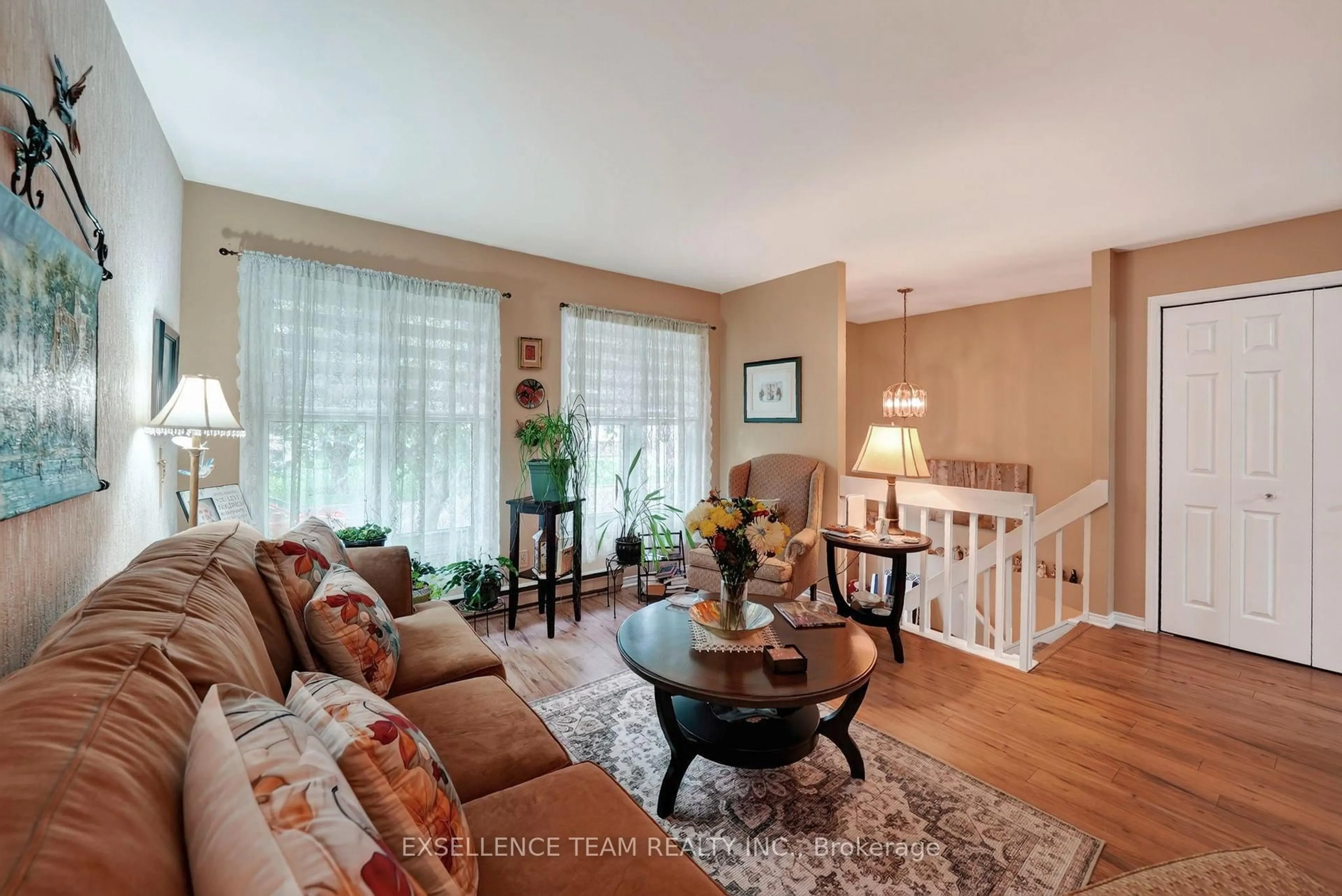 Living room with furniture, wood/laminate floor for 111 Glen Oaks Crt, Cornwall Ontario K6H 7E6