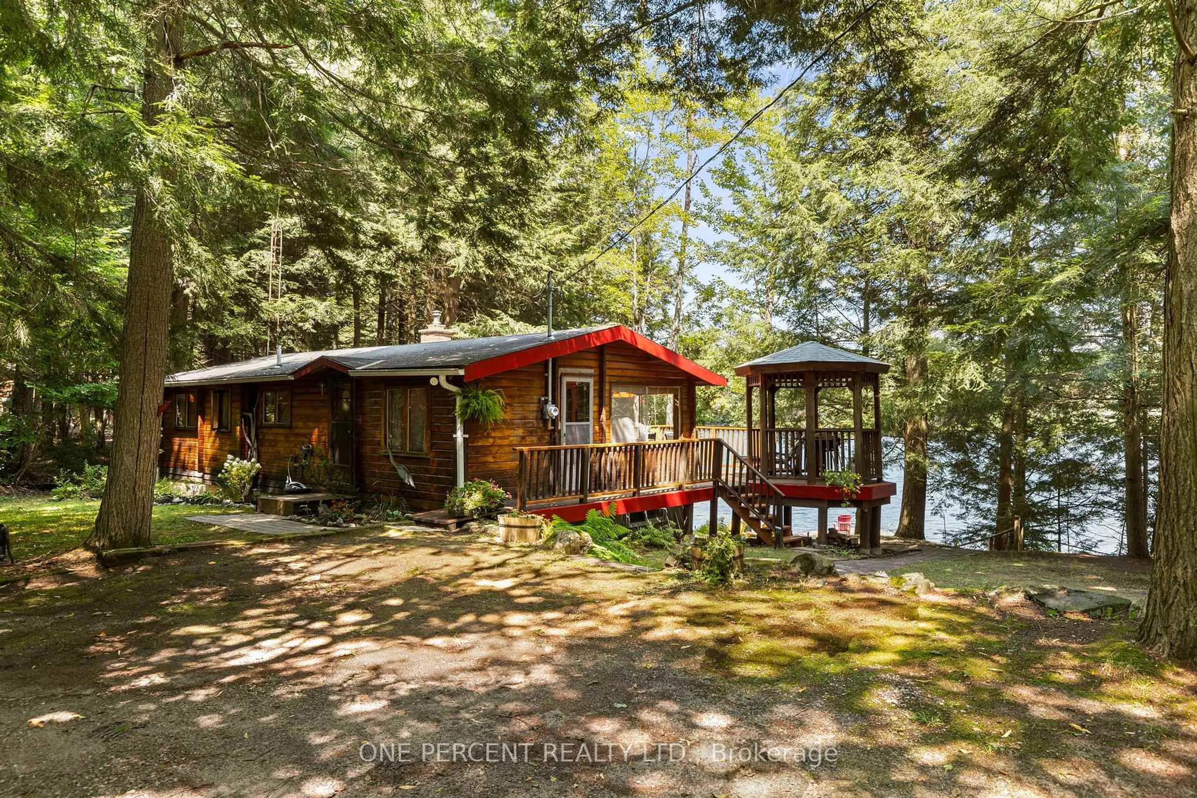 A pic from outside/outdoor area/front of a property/back of a property/a pic from drone, water/lake/river/ocean view for 1143 Butterfly Rd, Muskoka Lakes Ontario P0B 1J0