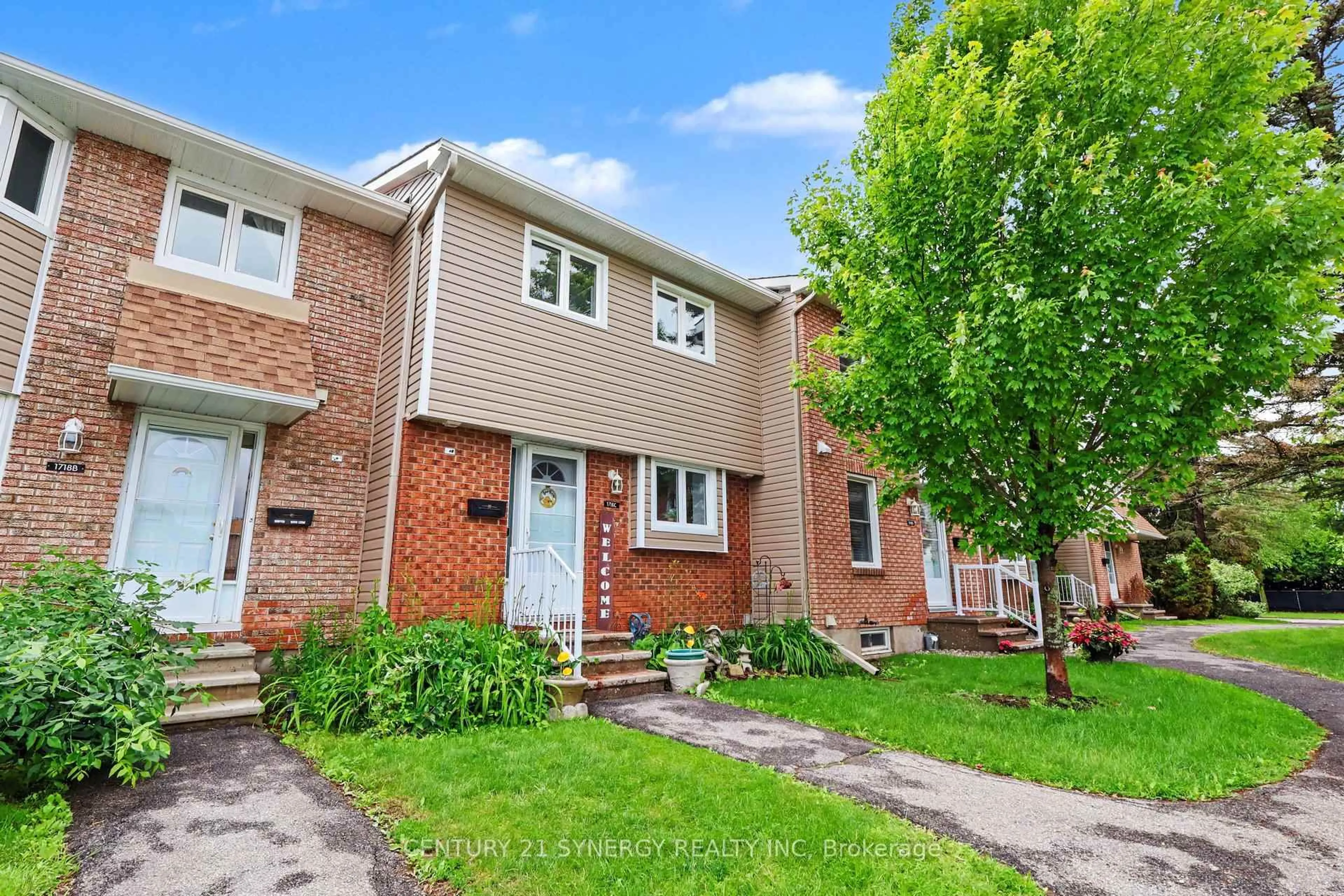 Home with brick exterior material, street for 1718 Lamoureux Dr #C, Orleans Ontario K1E 2N2