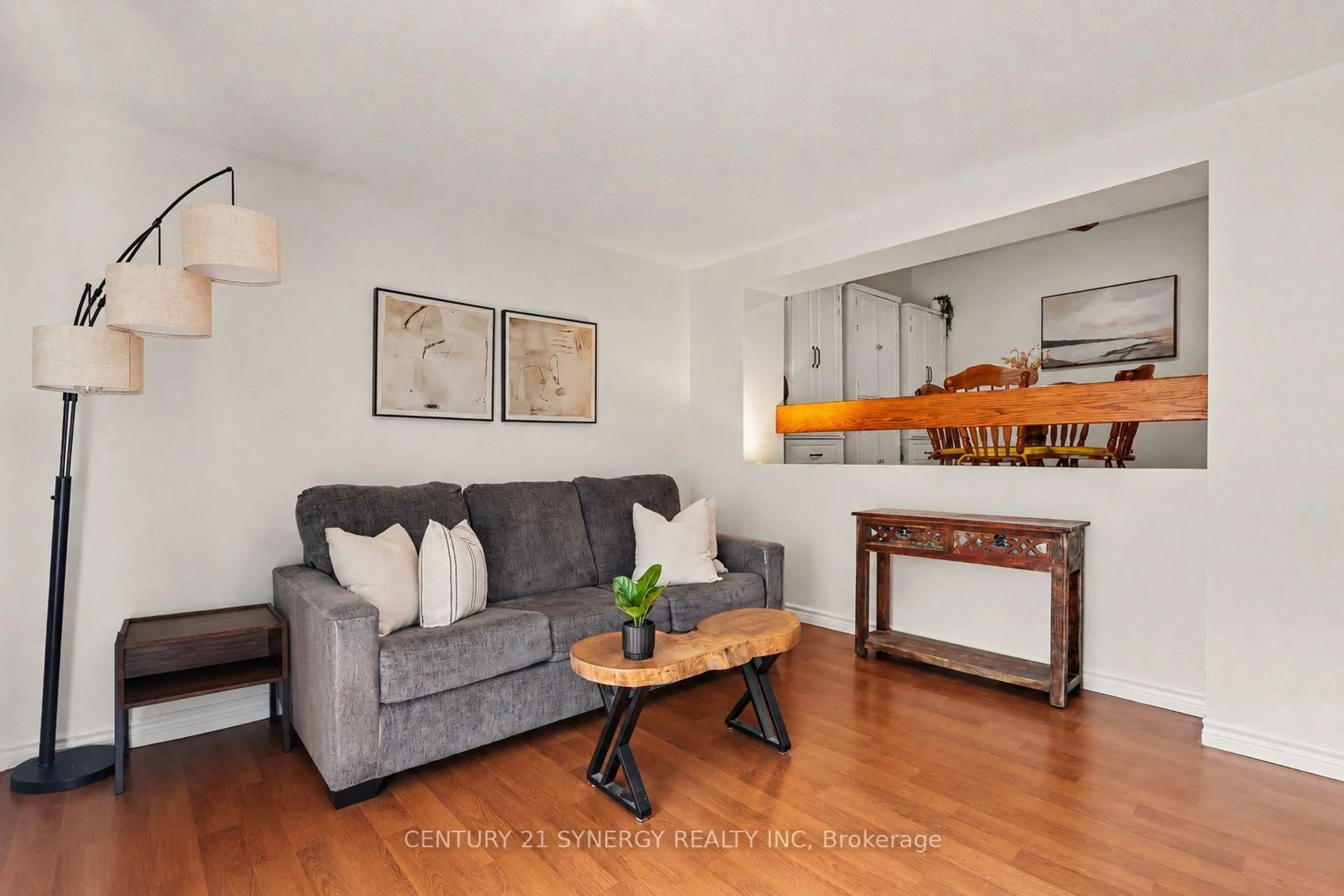 Living room with furniture, wood/laminate floor for 1718 Lamoureux Dr #C, Orleans Ontario K1E 2N2