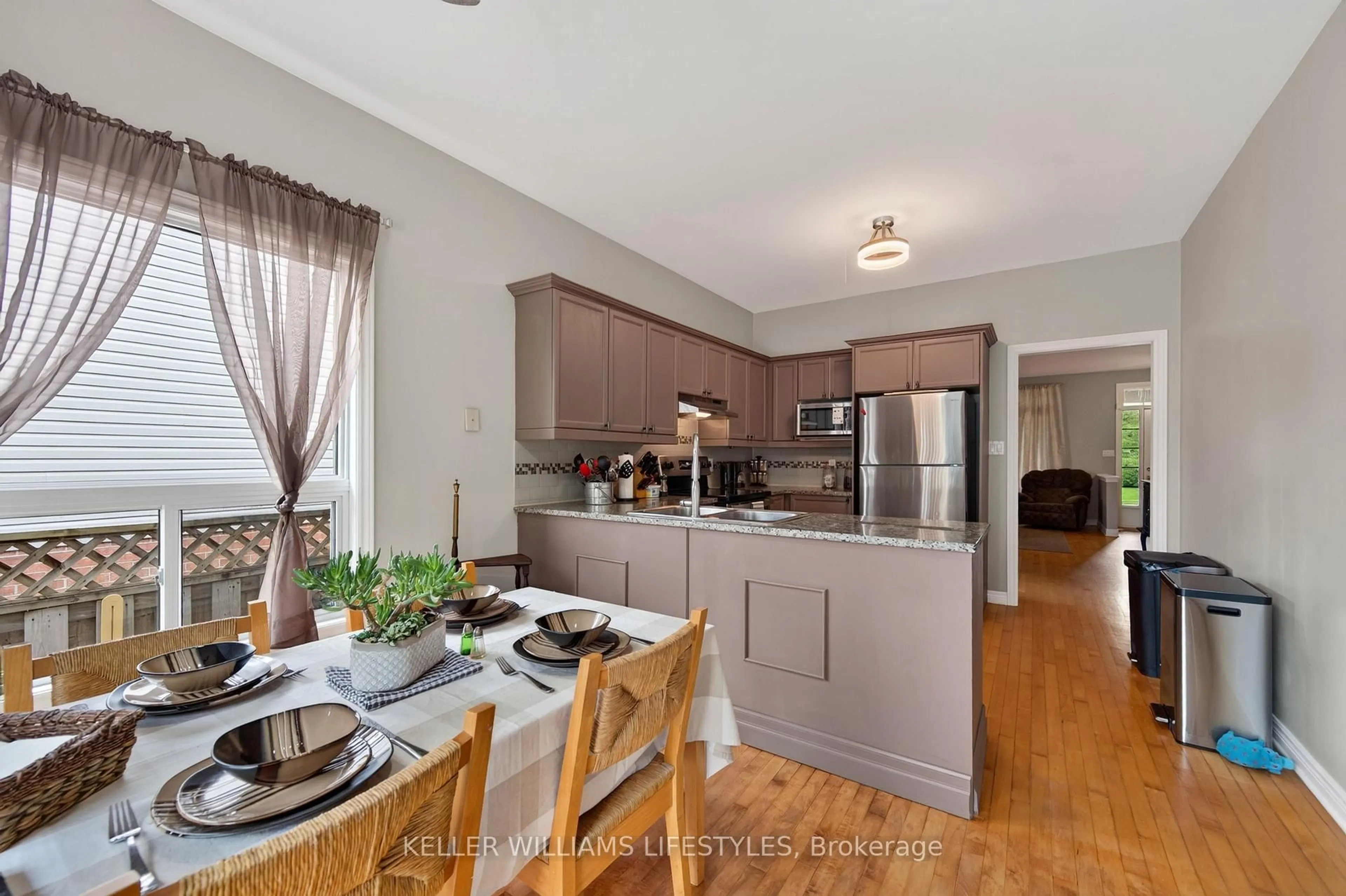 Open concept kitchen, wood/laminate floor for 227 Chelton Rd, London South Ontario N6M 1H9