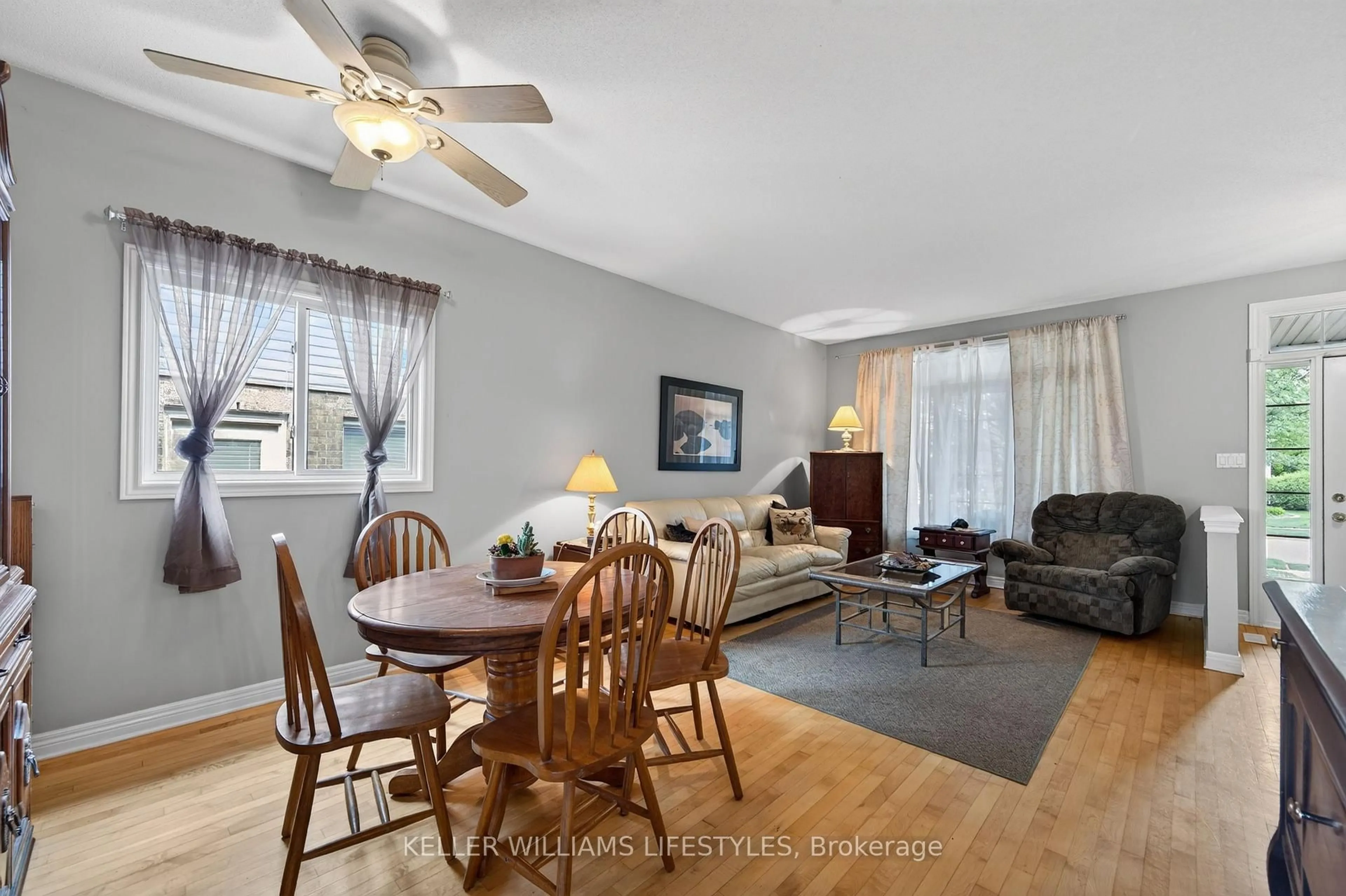 Living room with furniture, wood/laminate floor for 227 Chelton Rd, London South Ontario N6M 1H9