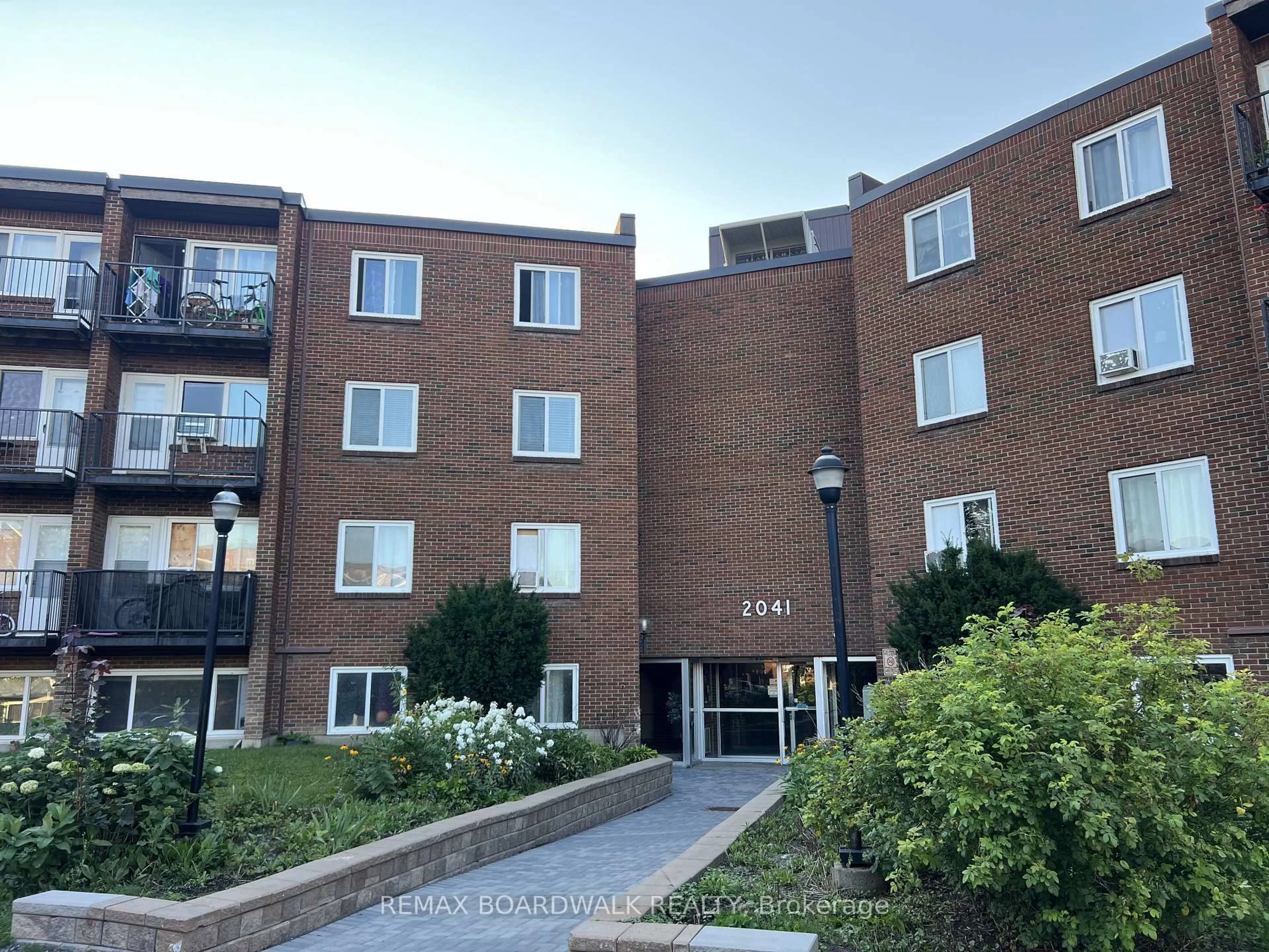 A pic from outside/outdoor area/front of a property/back of a property/a pic from drone, building for 2041 Arrowsmith Dr #101B, Ottawa Ontario K1J 7V7