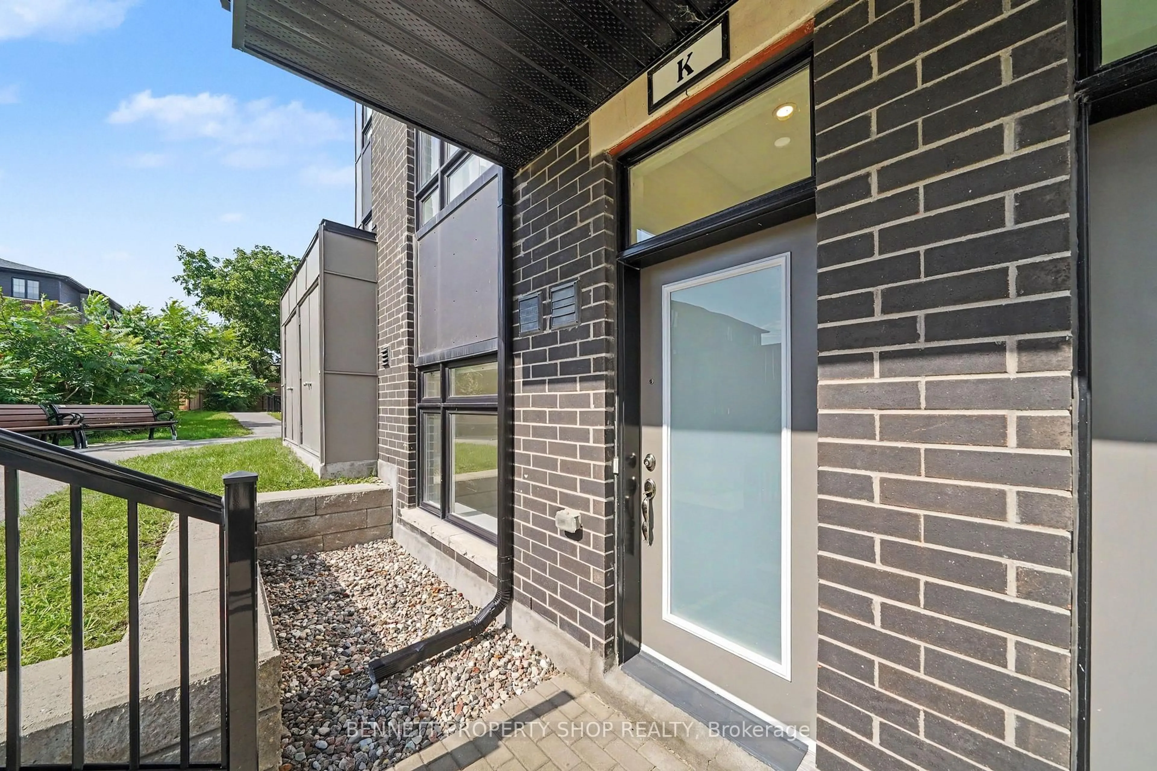 Home with brick exterior material, street for 410 Rolling Meadow Cres #K, Ottawa Ontario K1W 0S1