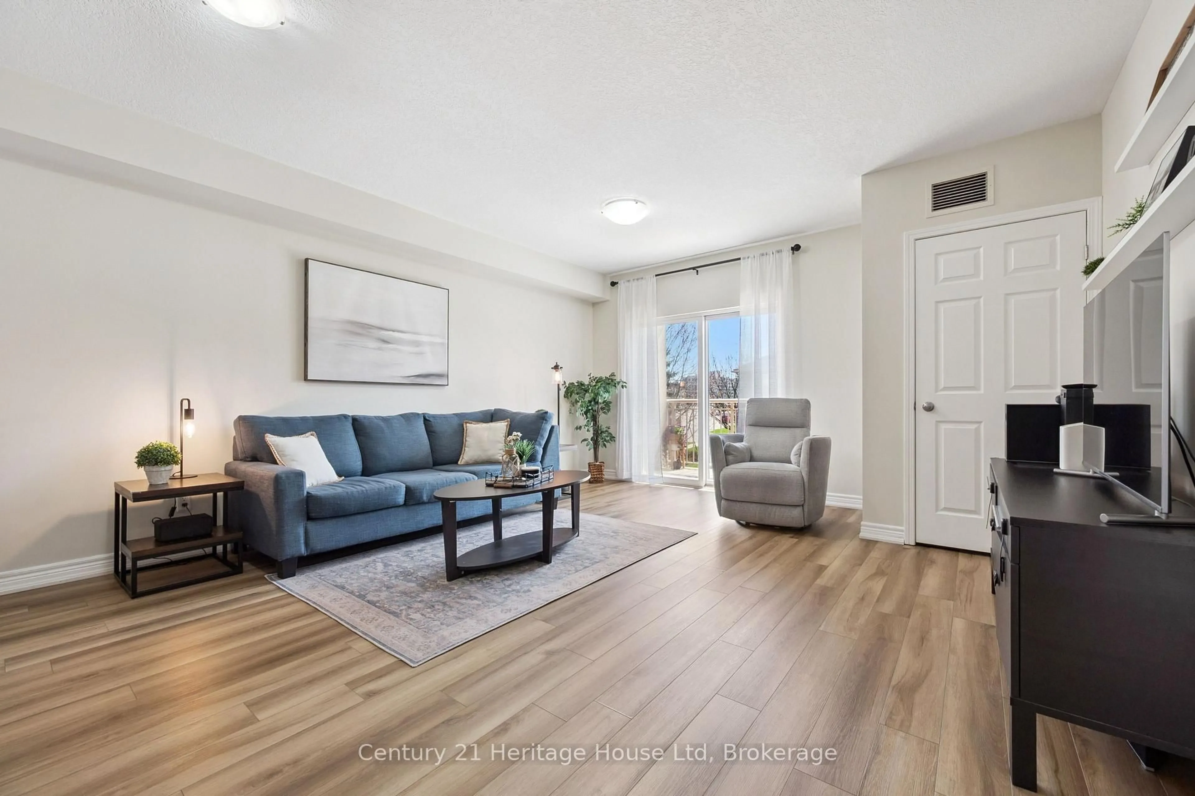 Living room with furniture, unknown for 901 Paisley Rd #207, Guelph Ontario N1K 0A7