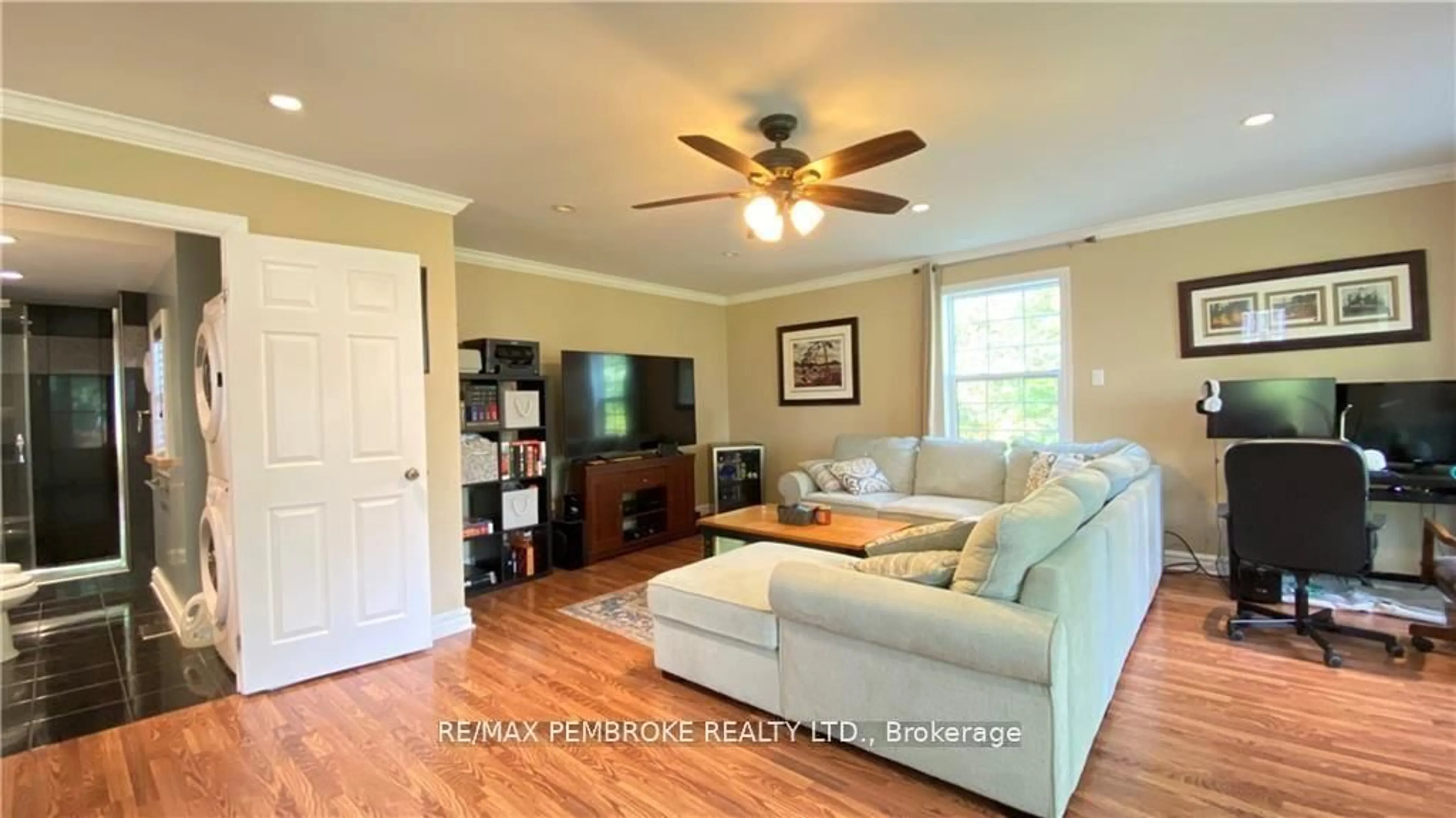Living room with furniture, wood/laminate floor for 16 Wolfe Ave, Deep River Ontario K0J 1P0