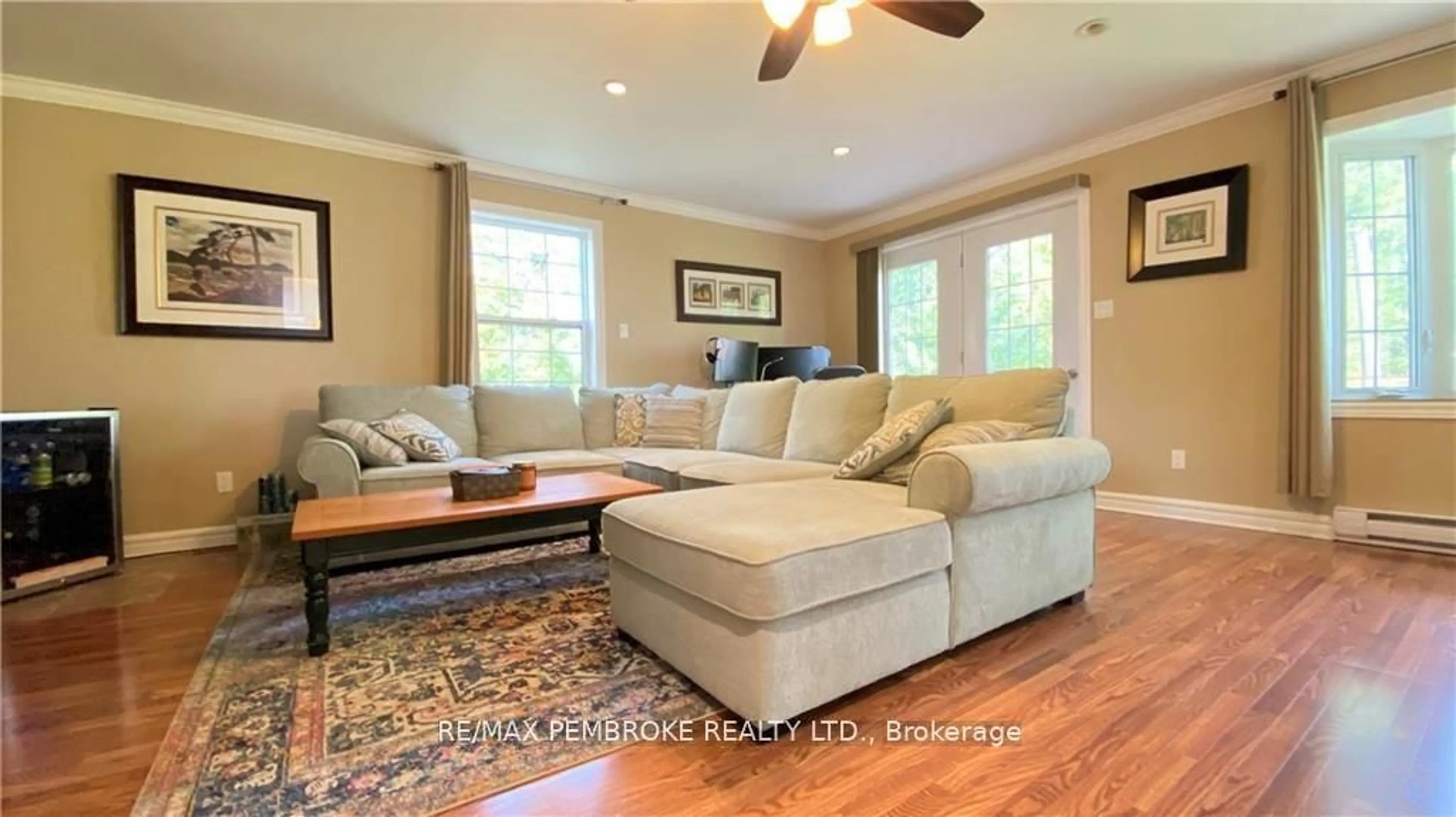 Living room with furniture, wood/laminate floor for 16 Wolfe Ave, Deep River Ontario K0J 1P0
