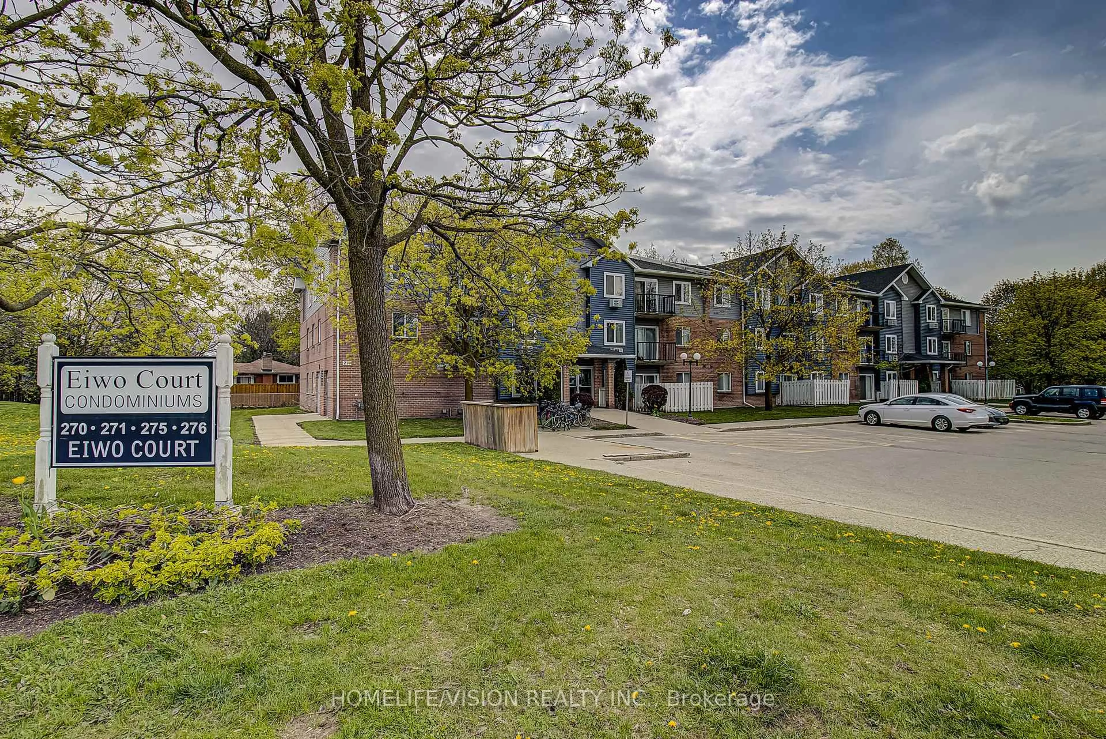A pic from outside/outdoor area/front of a property/back of a property/a pic from drone, street for 271 Eiwo Crt #310, Waterloo Ontario N2K 2M8