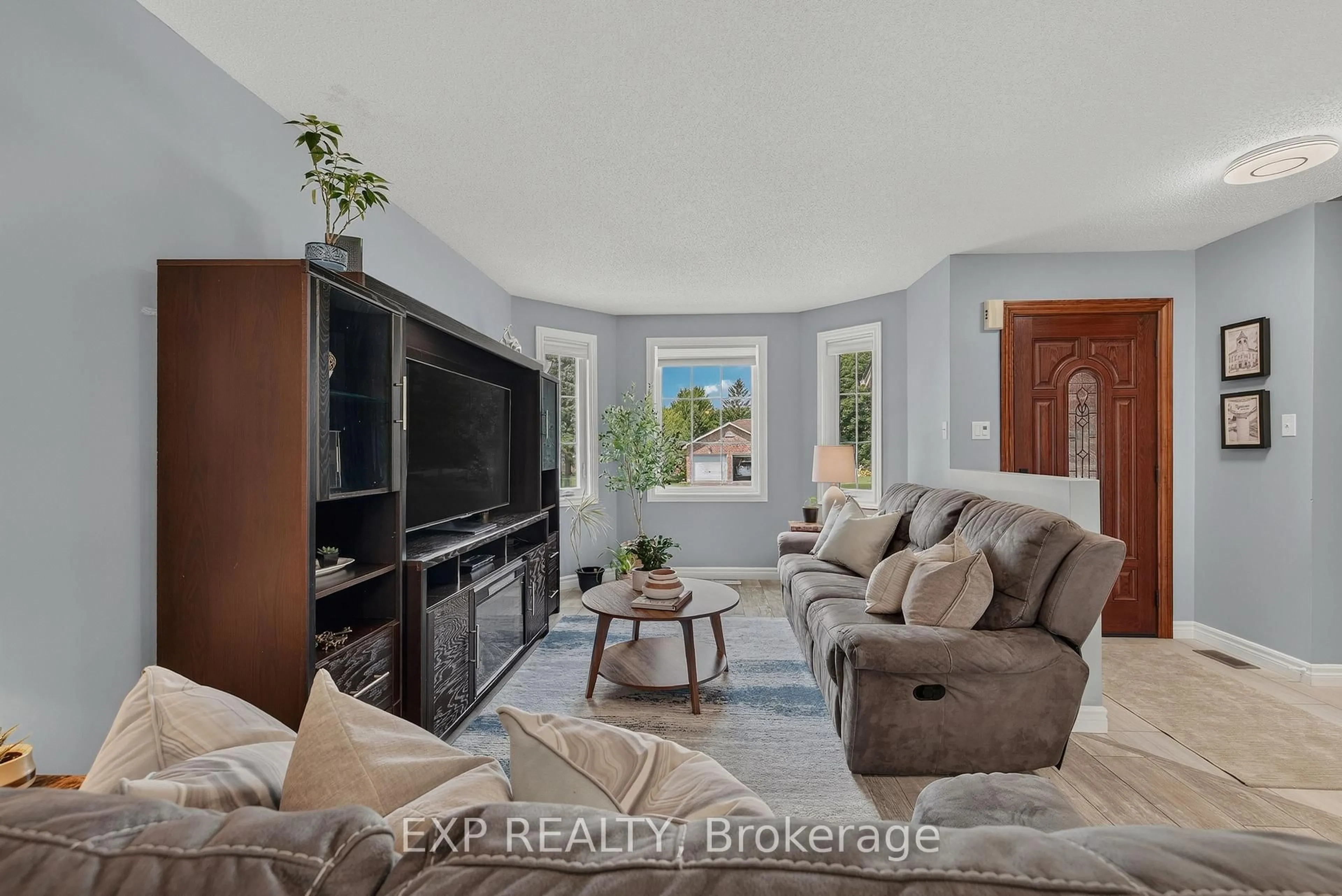 Living room with furniture, ceramic/tile floor for 11 Maple St, Mapleton Ontario N0G 1P0