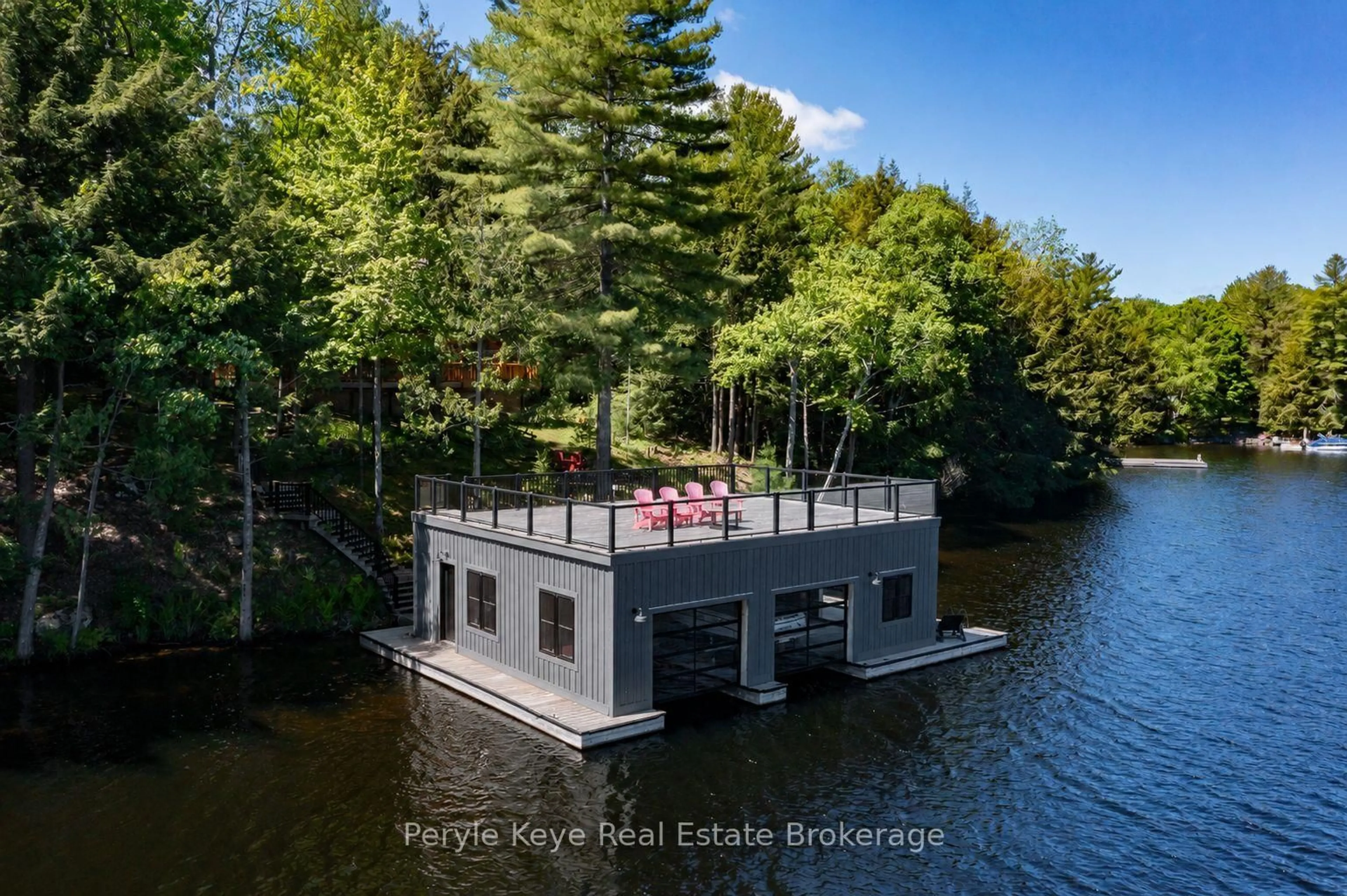 A pic from outside/outdoor area/front of a property/back of a property/a pic from drone, water/lake/river/ocean view for 22-26 Taylor Island, Gravenhurst Ontario P1P 1R2