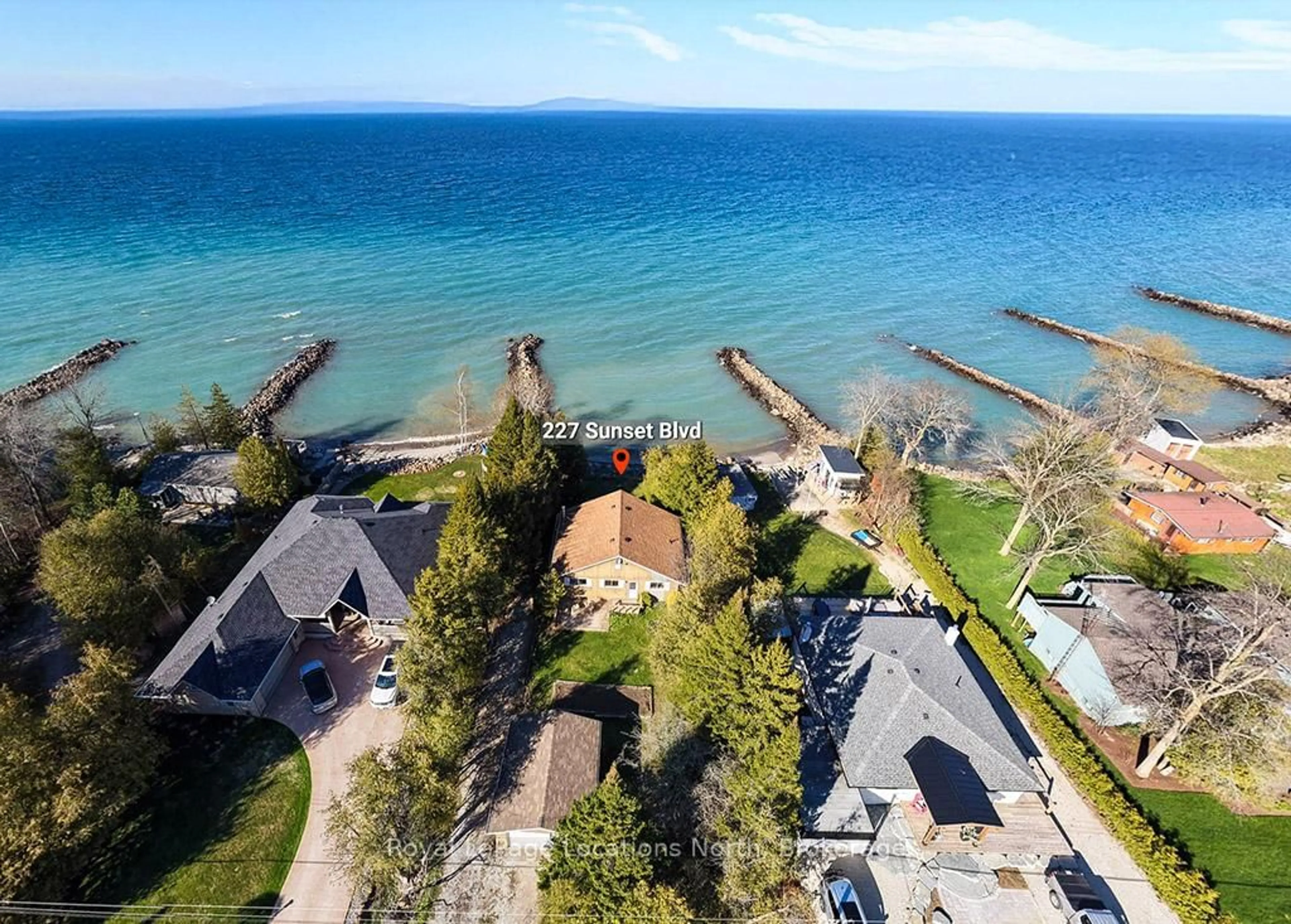 A pic from outside/outdoor area/front of a property/back of a property/a pic from drone, water/lake/river/ocean view for 227 Sunset Blvd, Blue Mountains Ontario N0H 2P0
