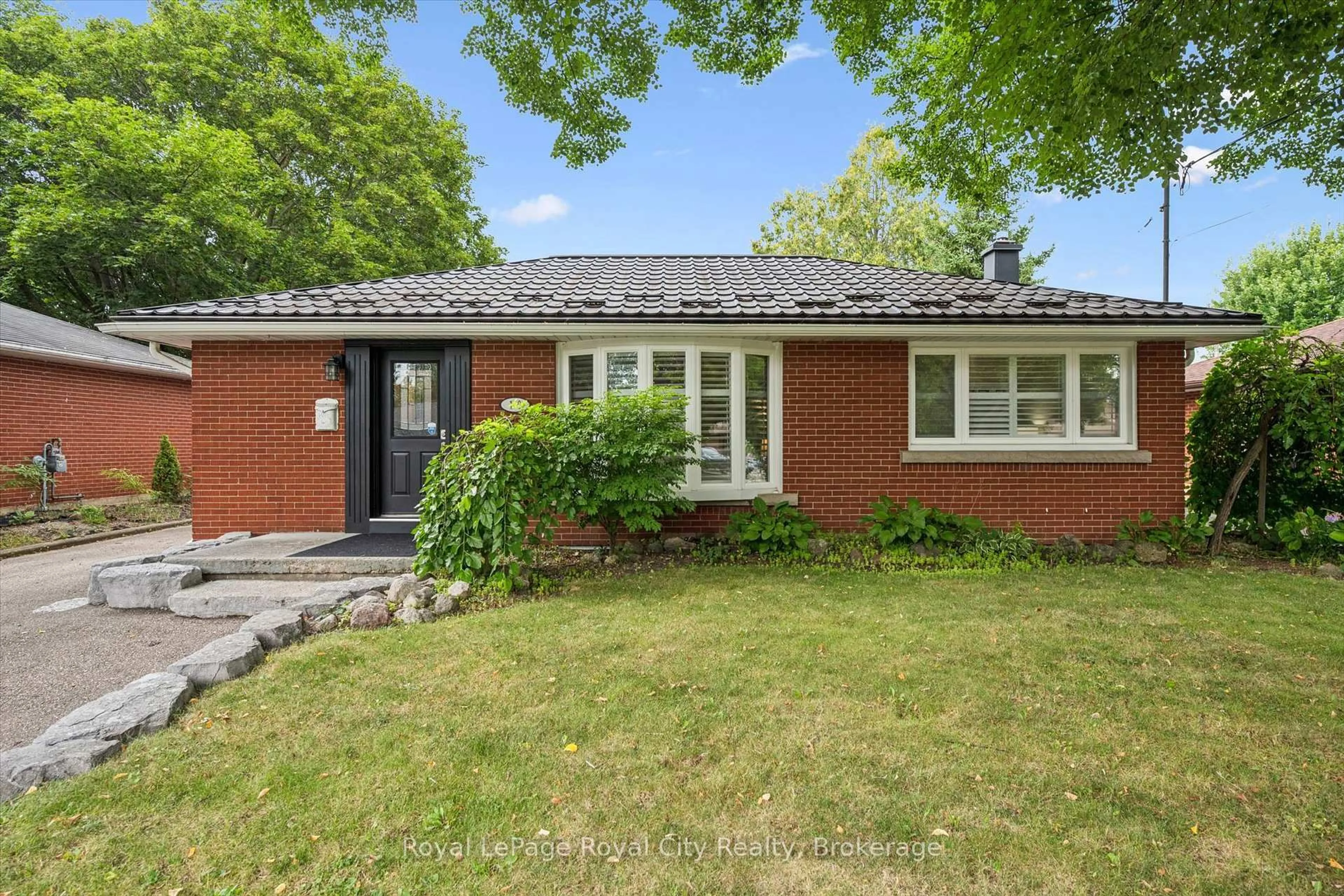 Home with brick exterior material, street for 10 Sumac Pl, Guelph Ontario N1E 1K9