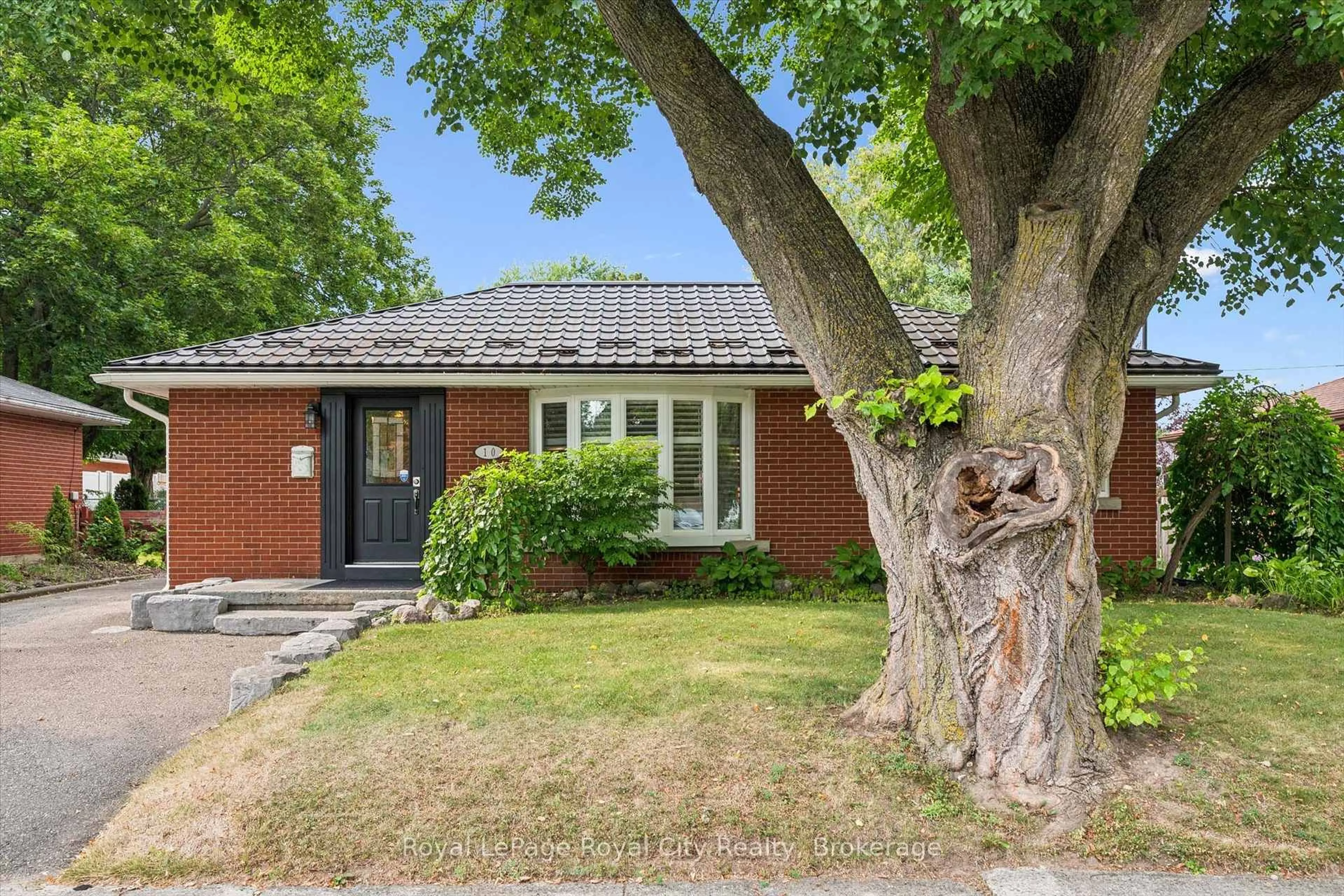 Home with brick exterior material, street for 10 Sumac Pl, Guelph Ontario N1E 1K9