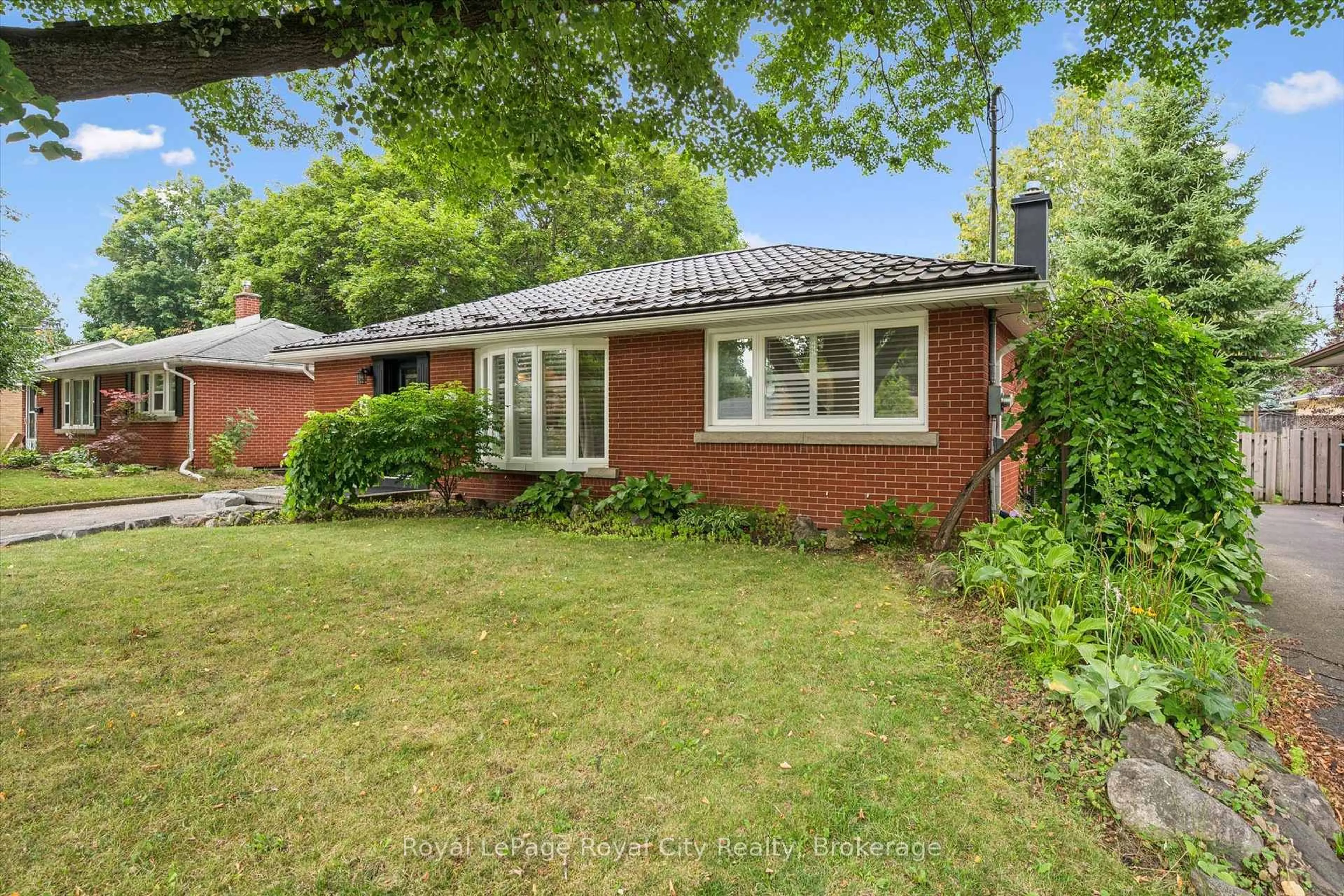 Home with brick exterior material, street for 10 Sumac Pl, Guelph Ontario N1E 1K9