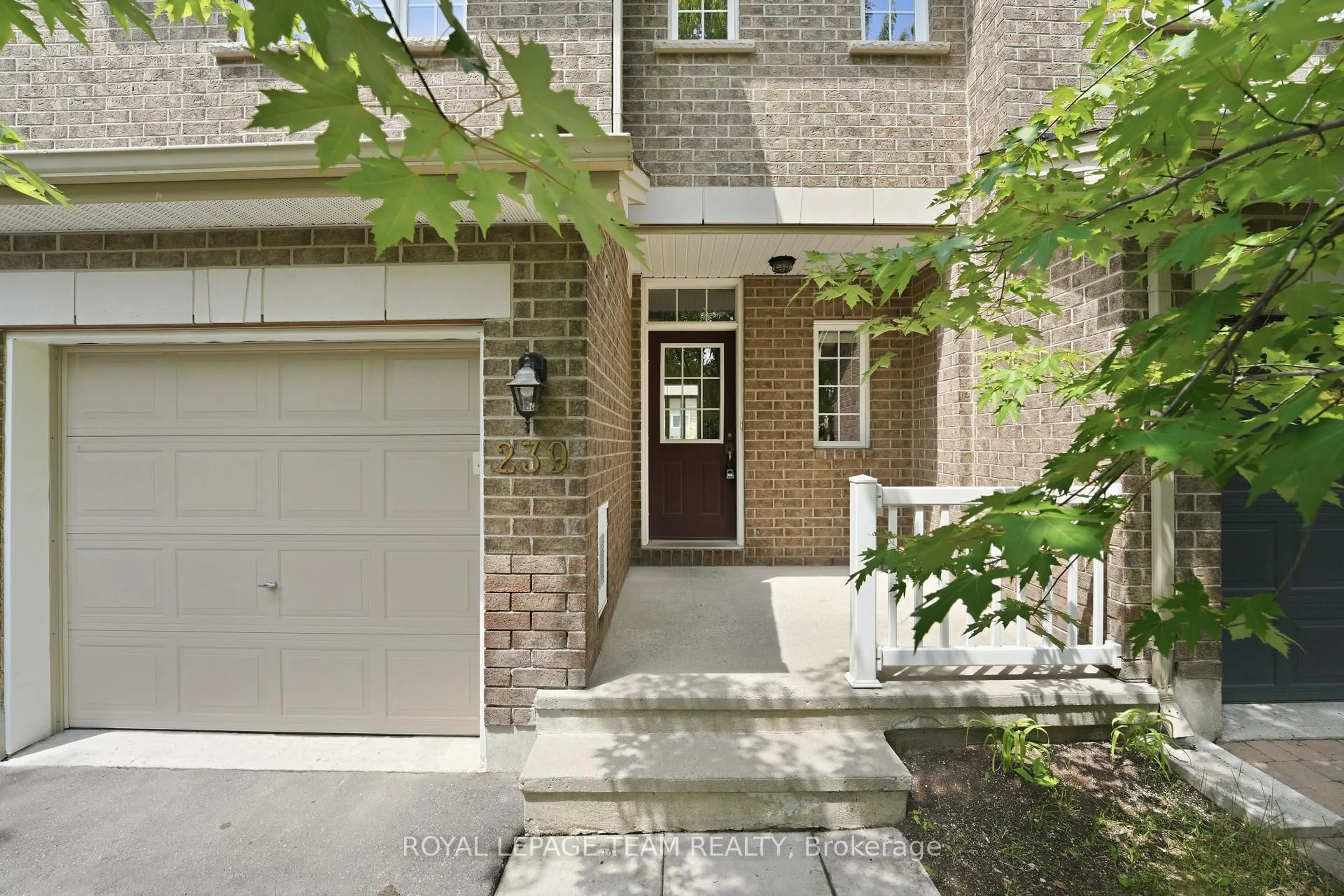 Home with brick exterior material, street for 239 Tandalee Cres, Ottawa Ontario K2M 0A2
