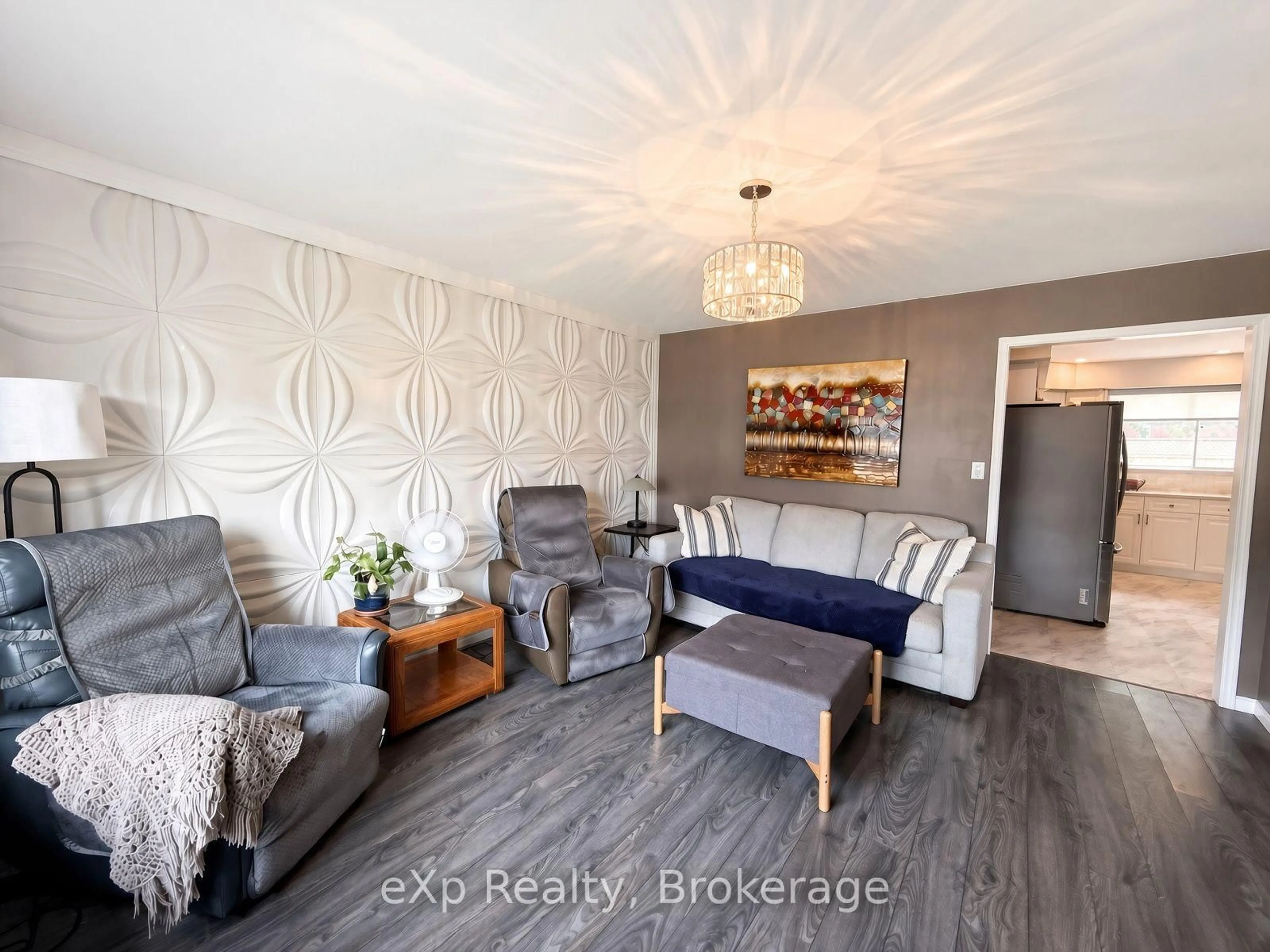 Living room with furniture, wood/laminate floor for 23 12th St, Arran-Elderslie Ontario N0G 1L0