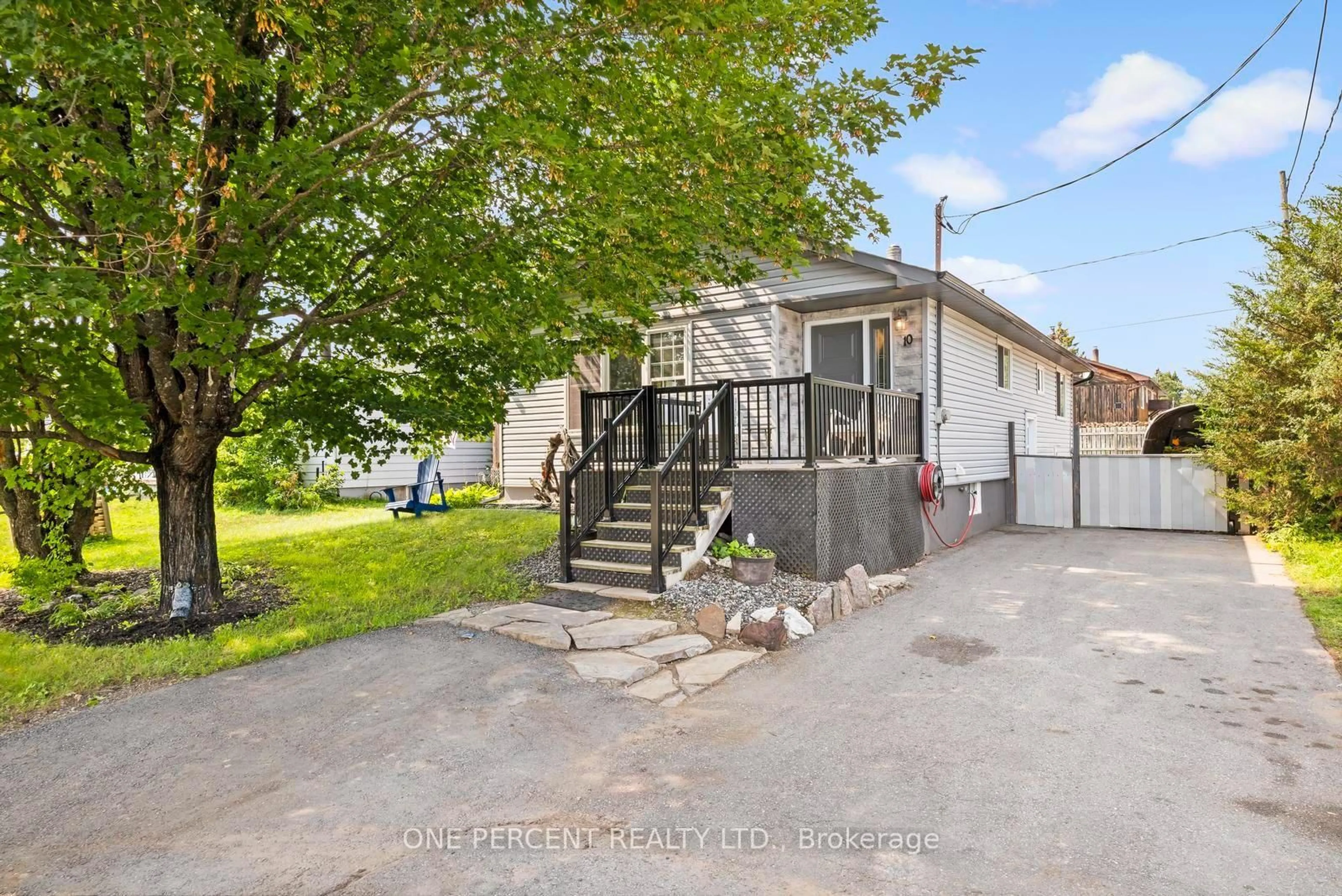 A pic from outside/outdoor area/front of a property/back of a property/a pic from drone, street for 10 Magnolia St, Highlands East Ontario K0L 1M0