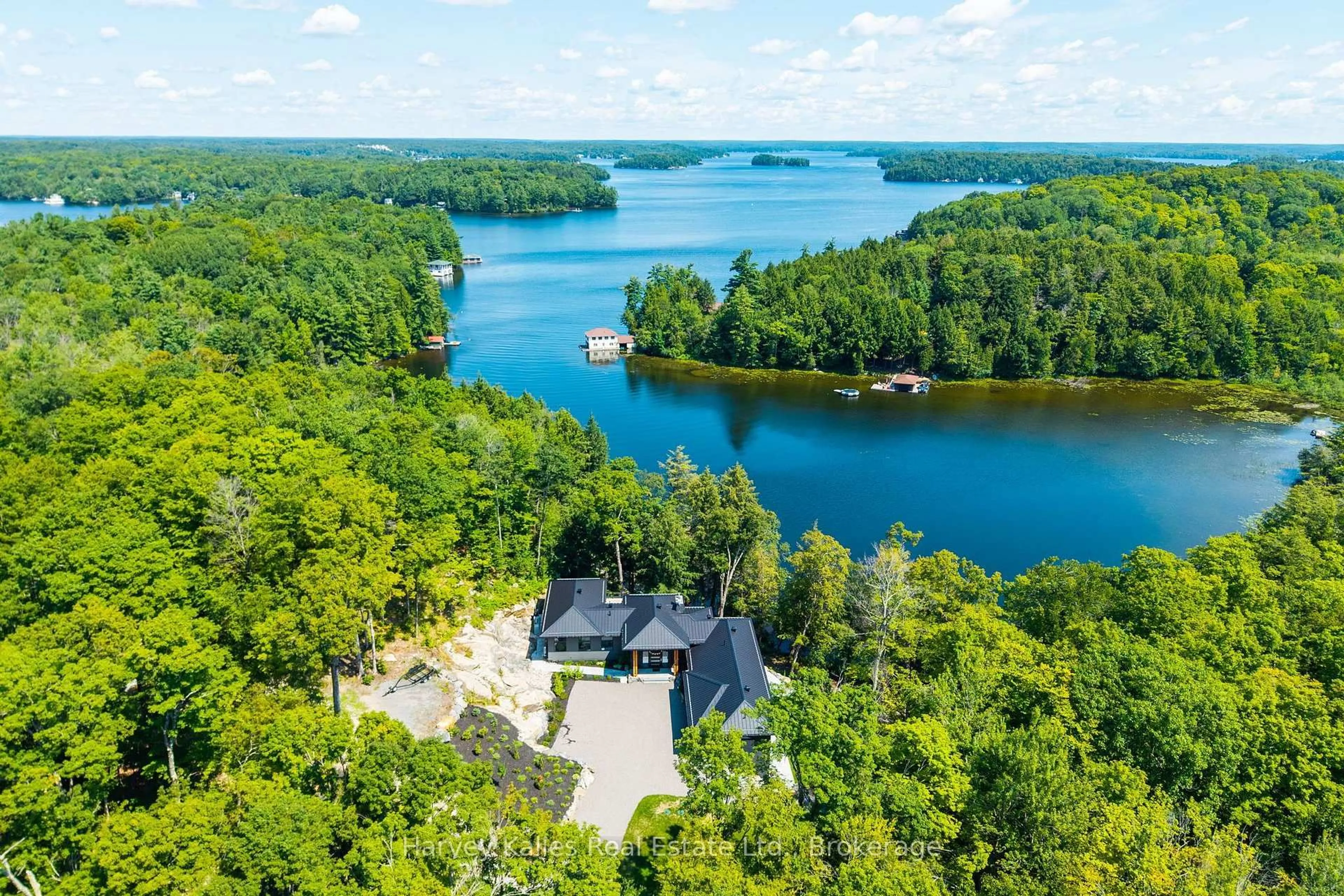 A pic from outside/outdoor area/front of a property/back of a property/a pic from drone, water/lake/river/ocean view for 1013 Halls Rd #2, Muskoka Lakes Ontario P0B 1J0