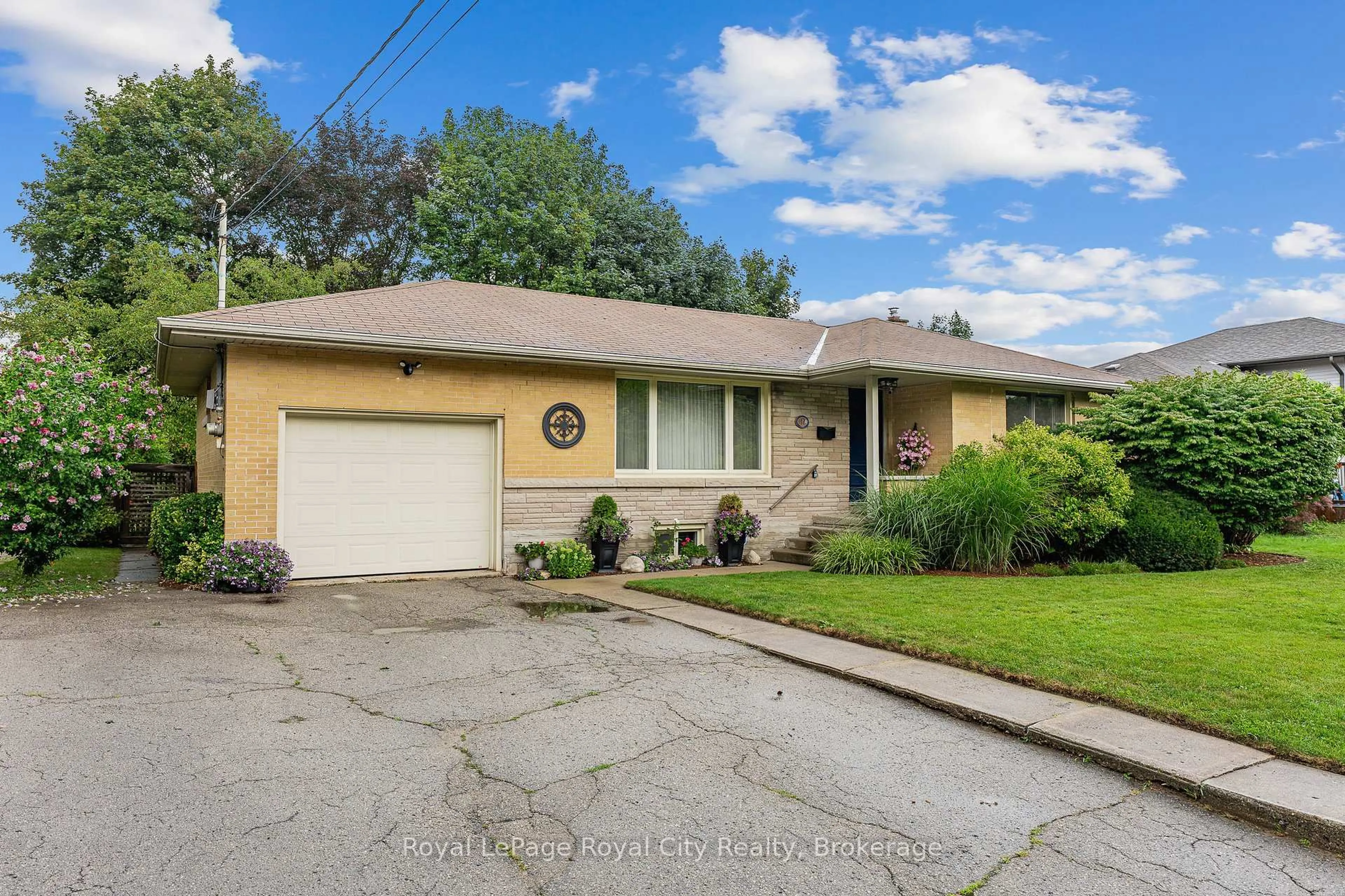 Home with vinyl exterior material, street for 12 Tobey Ave, Guelph Ontario N1E 1Y6