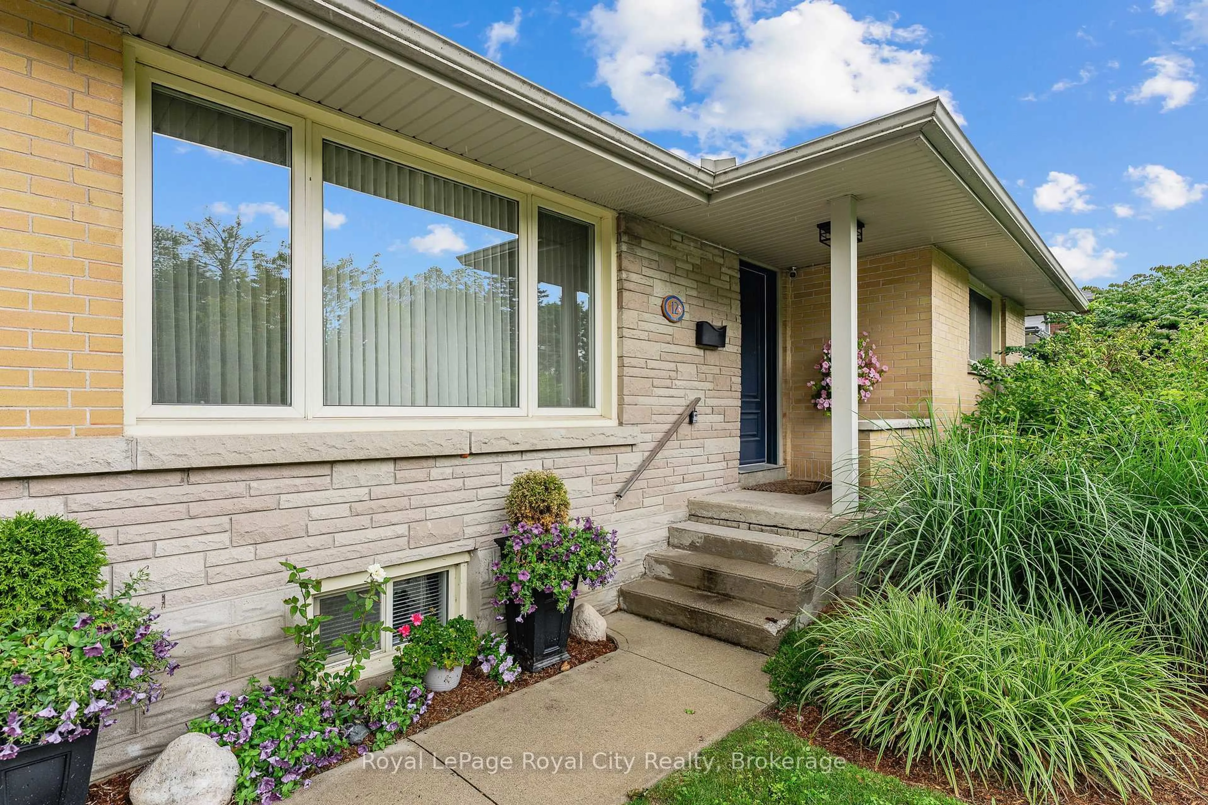 Home with brick exterior material, street for 12 Tobey Ave, Guelph Ontario N1E 1Y6