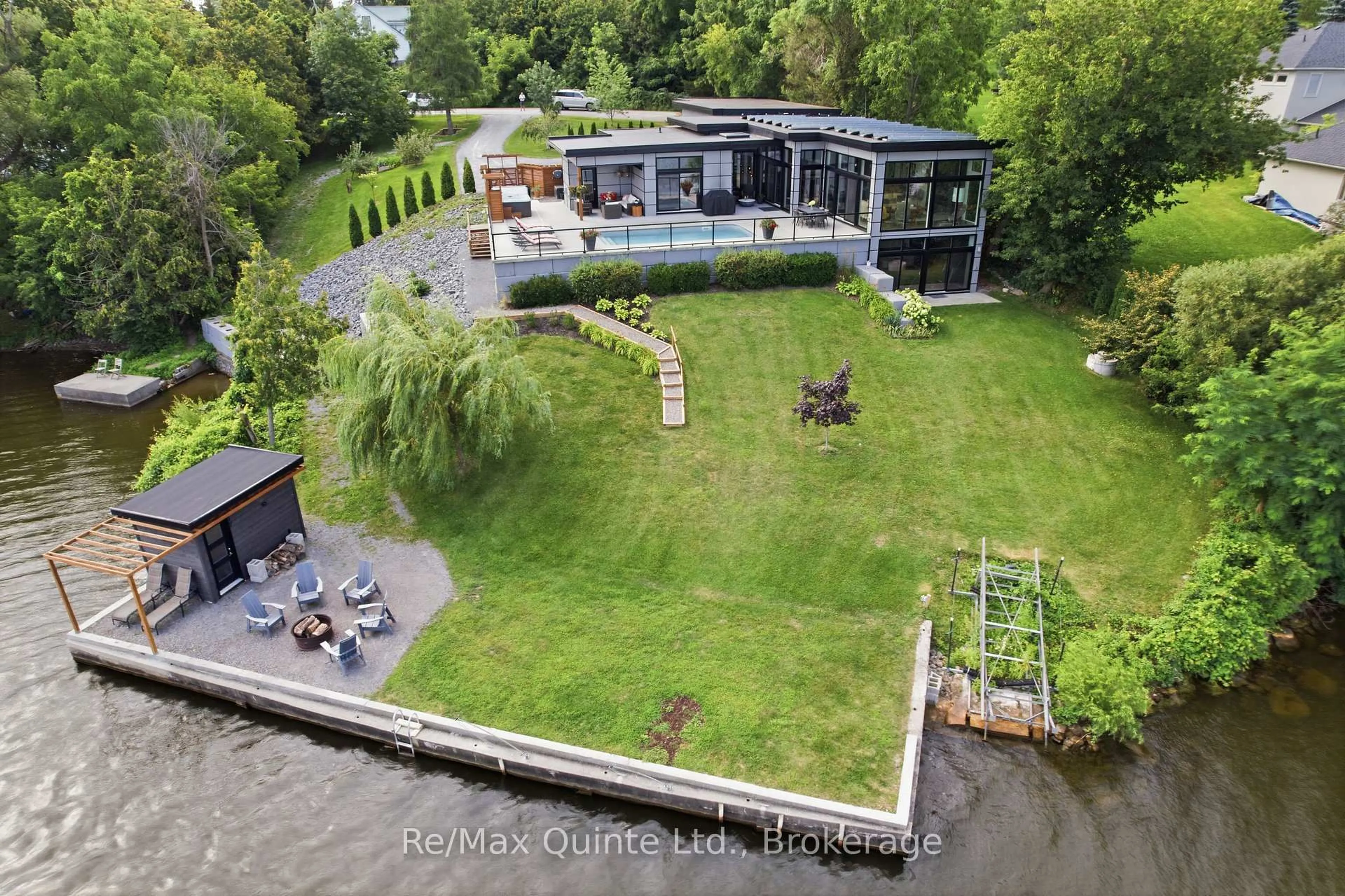 A pic from outside/outdoor area/front of a property/back of a property/a pic from drone, water/lake/river/ocean view for 8 Bayview Point Rd, Prince Edward County Ontario K8N 4Z1