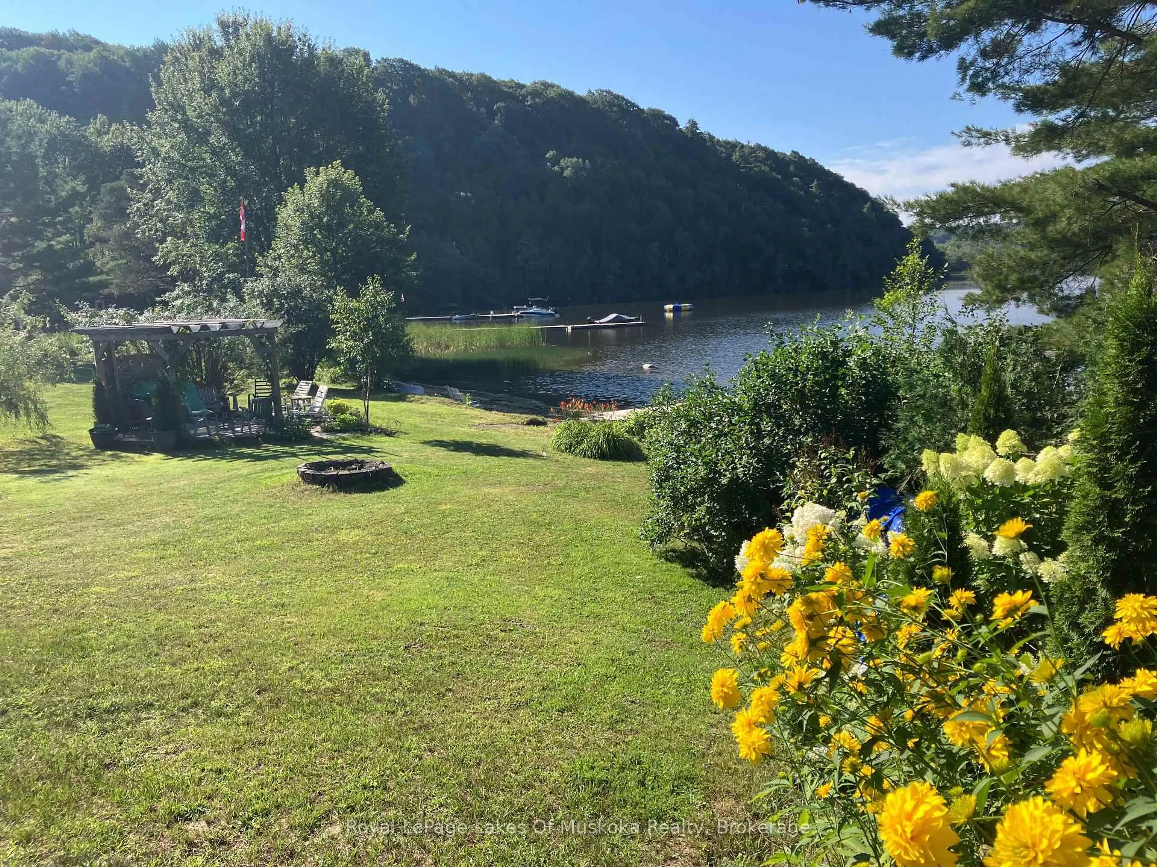 A pic from outside/outdoor area/front of a property/back of a property/a pic from drone, water/lake/river/ocean view for 1052 Cove Rd #1, Muskoka Lakes Ontario P0B 1M0