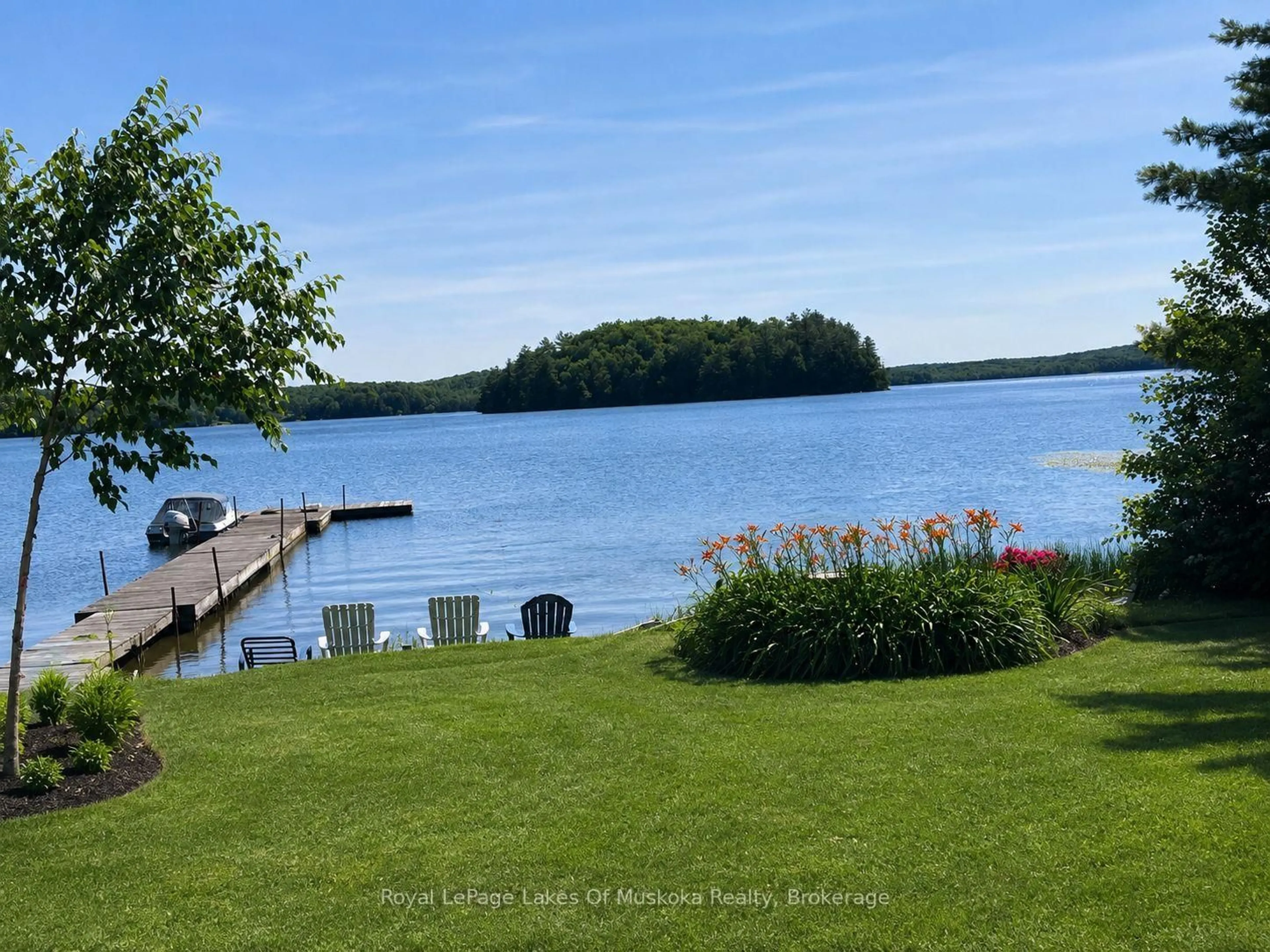 A pic from outside/outdoor area/front of a property/back of a property/a pic from drone, water/lake/river/ocean view for 1052 Cove Rd #1, Muskoka Lakes Ontario P0B 1M0