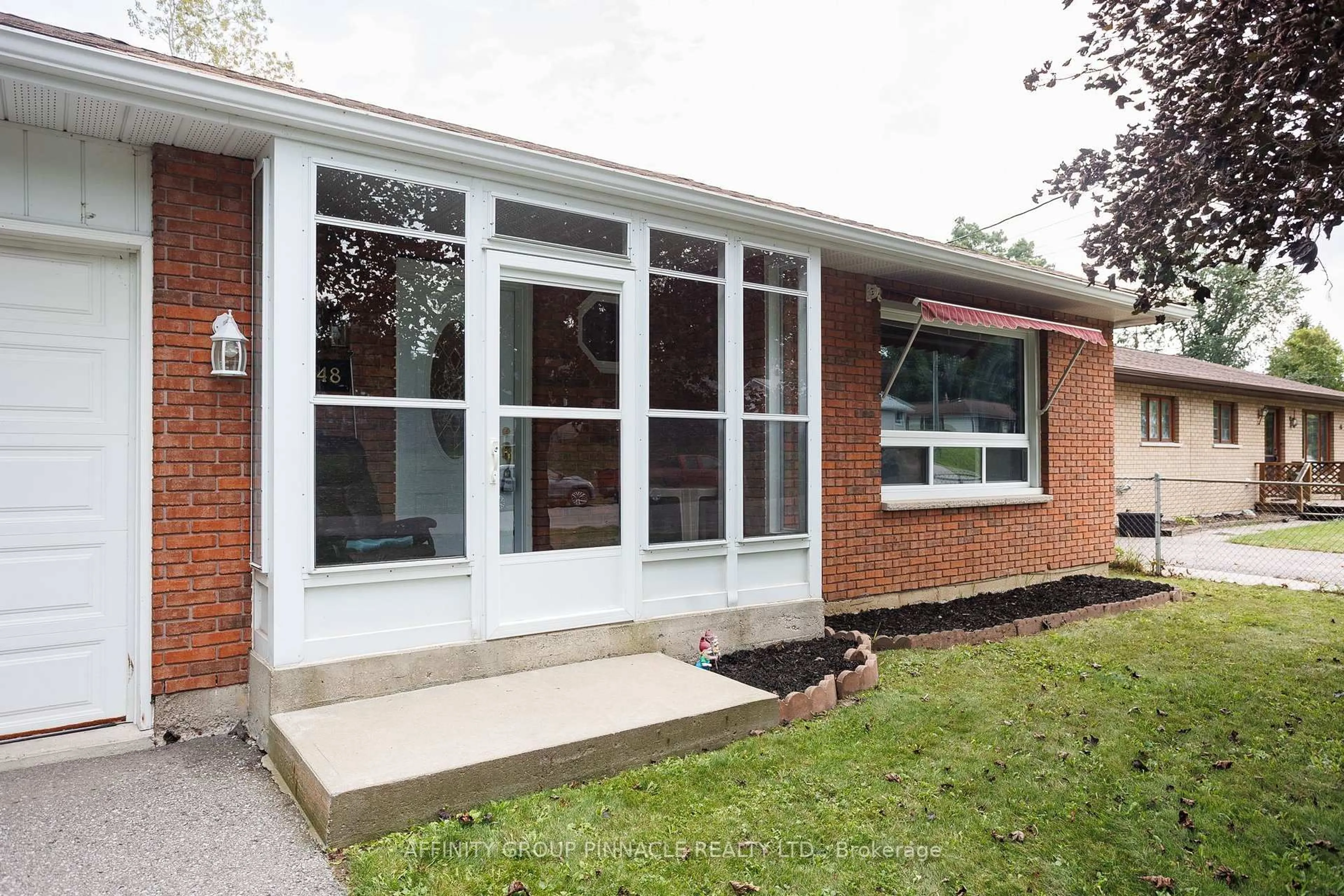 Home with brick exterior material, street for 48 Kennedy Dr, Kawartha Lakes Ontario K0M 1N0
