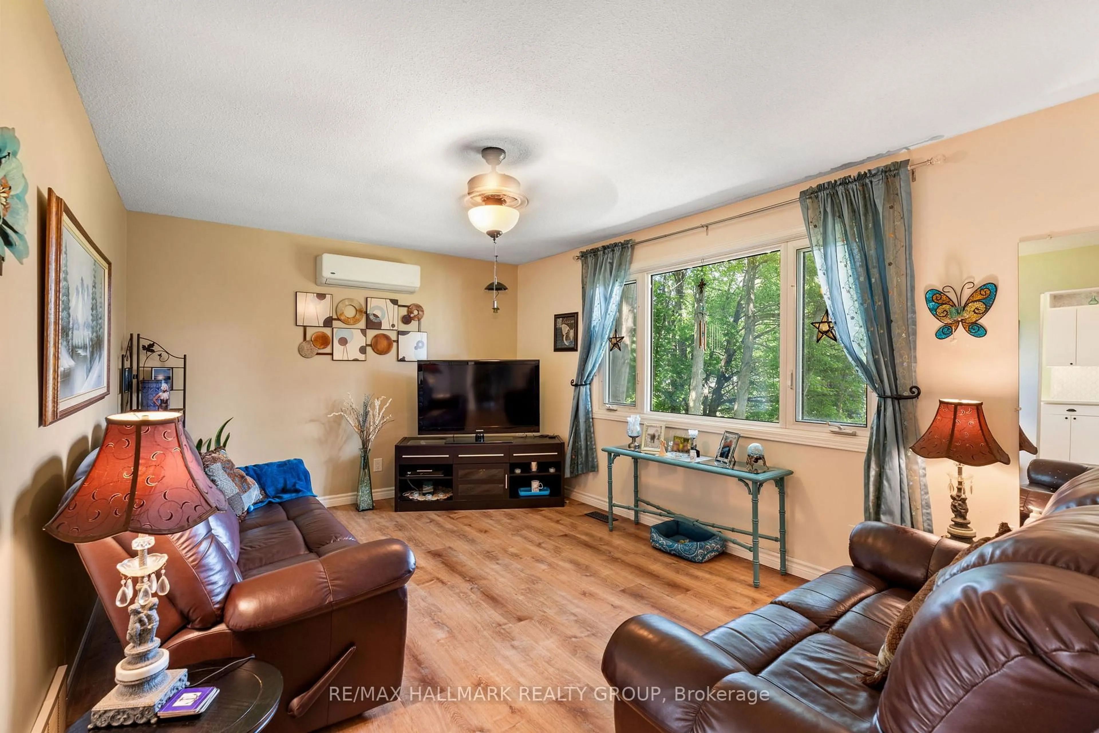 Living room with furniture, wood/laminate floor for 4574 County Road 15 Rd, Augusta Ontario K6V 5T2