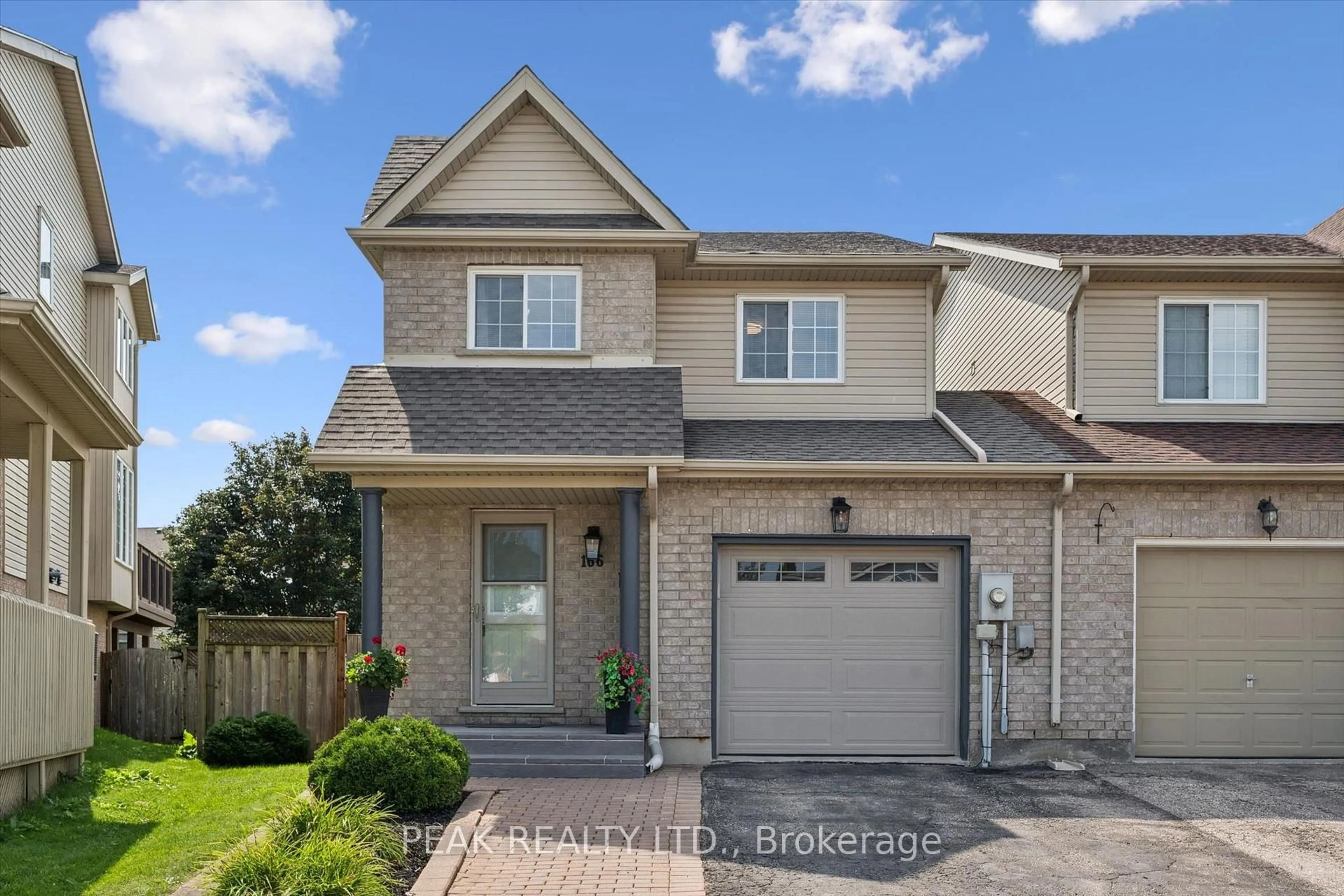 Home with brick exterior material, street for 166 Windflower Dr, Kitchener Ontario N2E 3T2